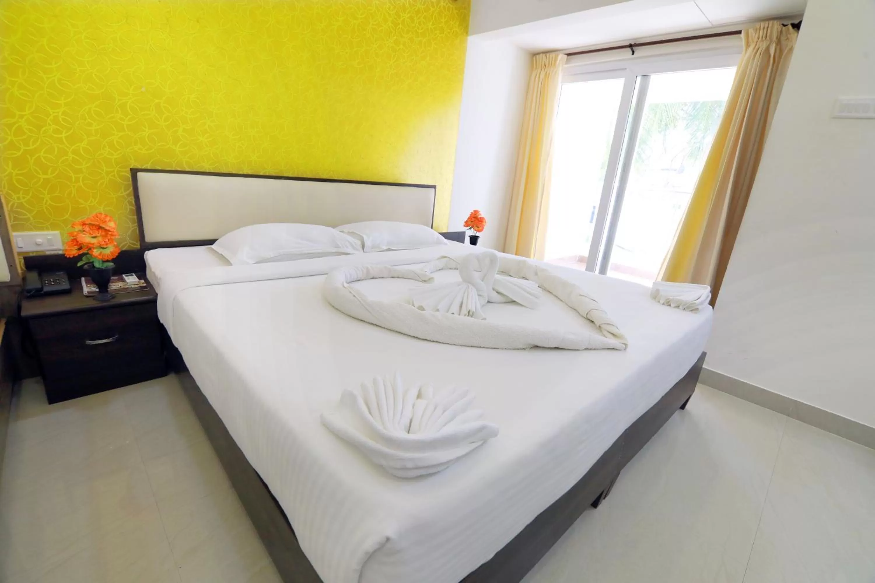 Bed in Hotel Ambai Grand