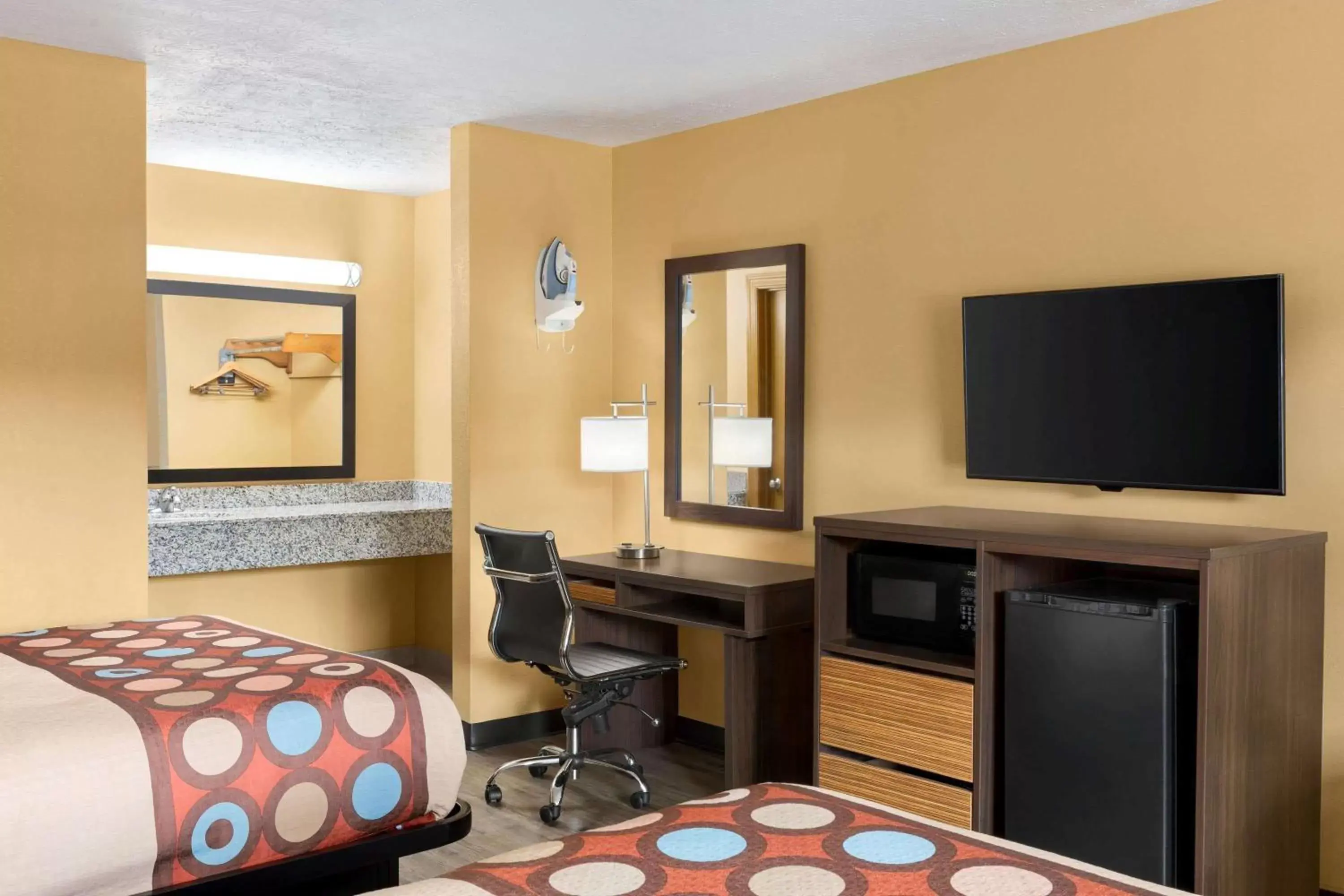 Photo of the whole room, TV/Entertainment Center in Super 8 by Wyndham Whites Creek/ Nashville NW Area