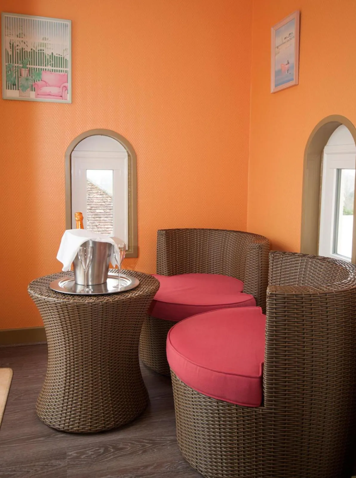 Seating area in Logis Hôtel Restaurant Le Coq Hardi