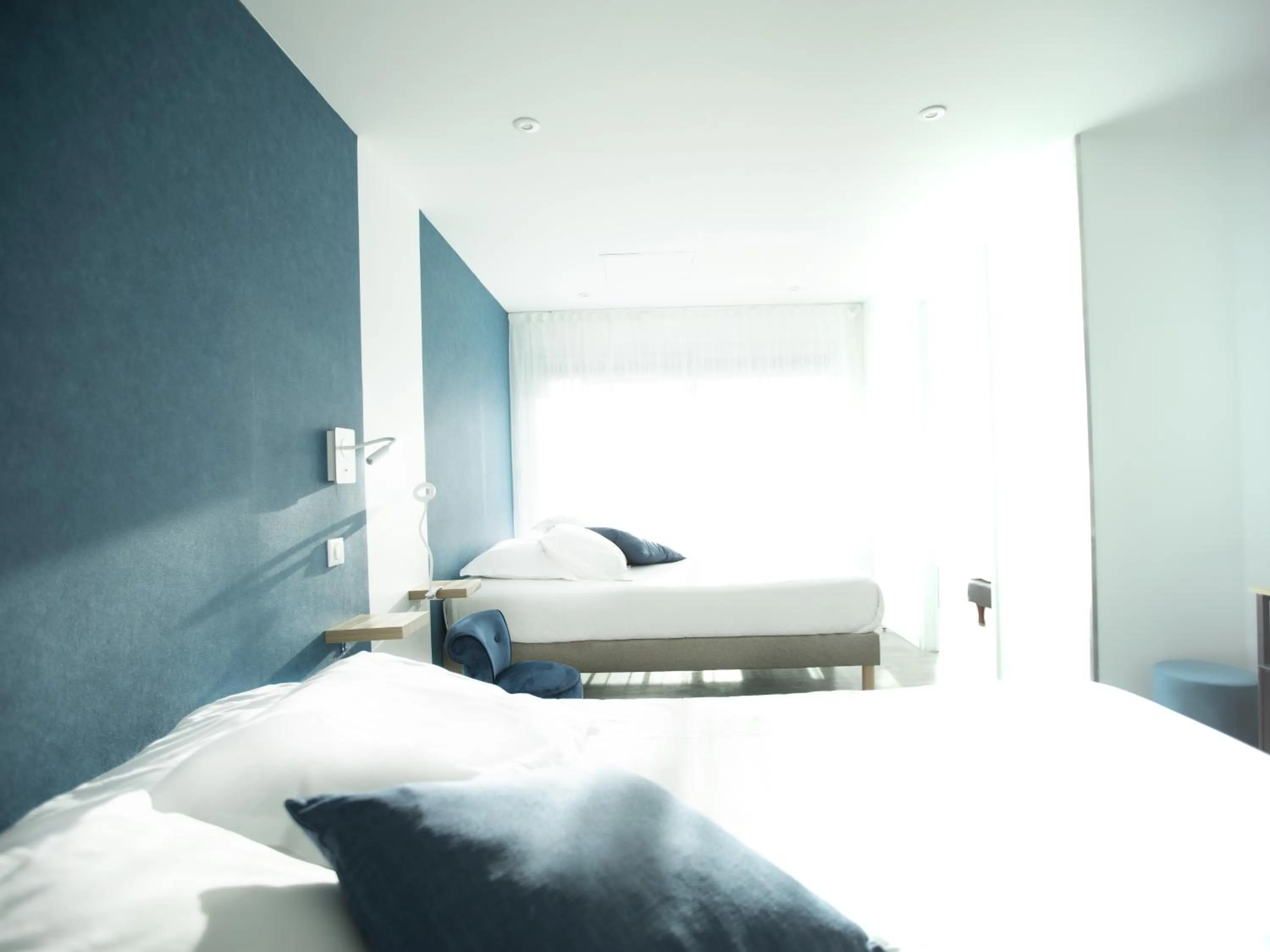 Bed in Tiercé Hotel