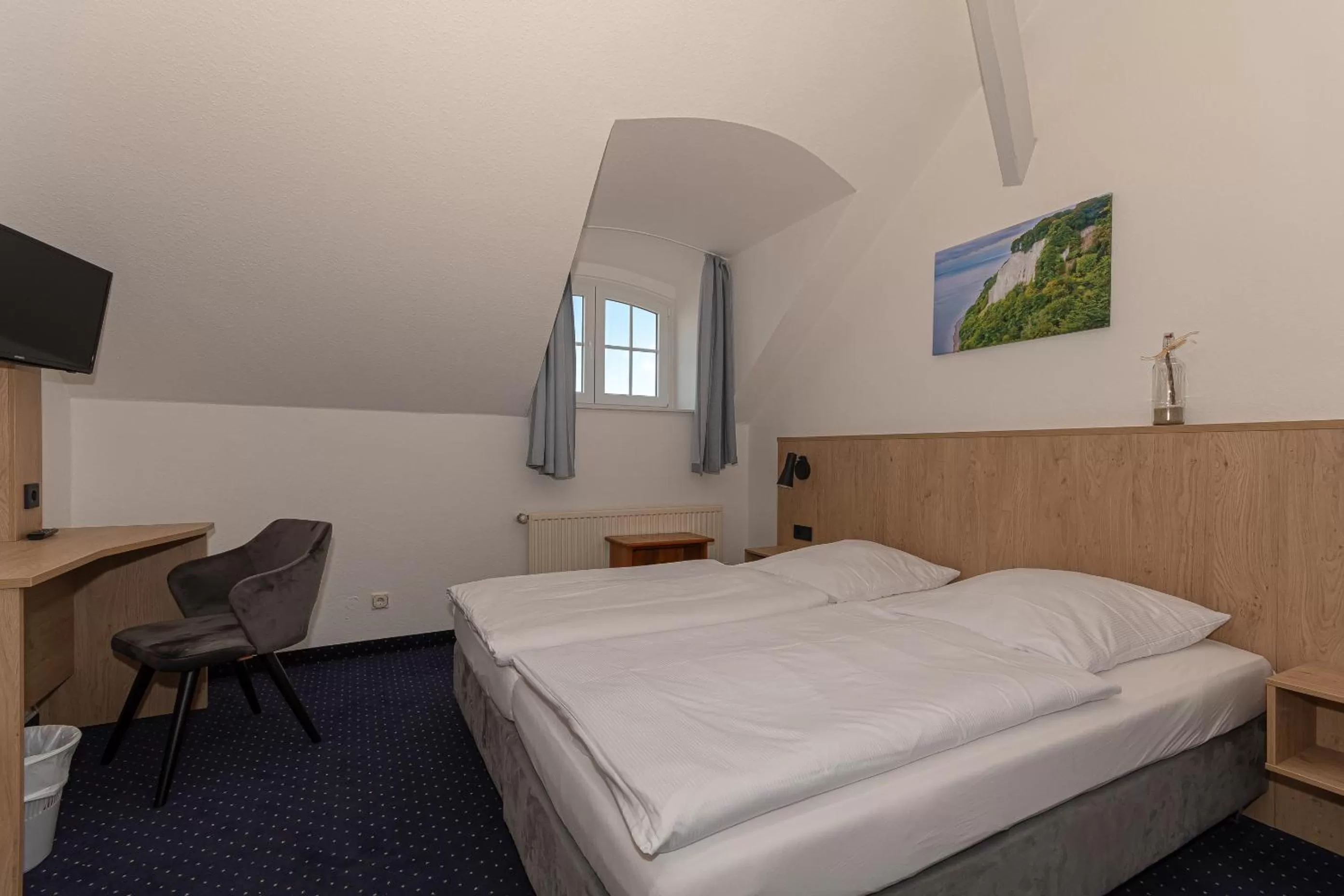 Photo of the whole room, Bed in Kurhotel Sassnitz