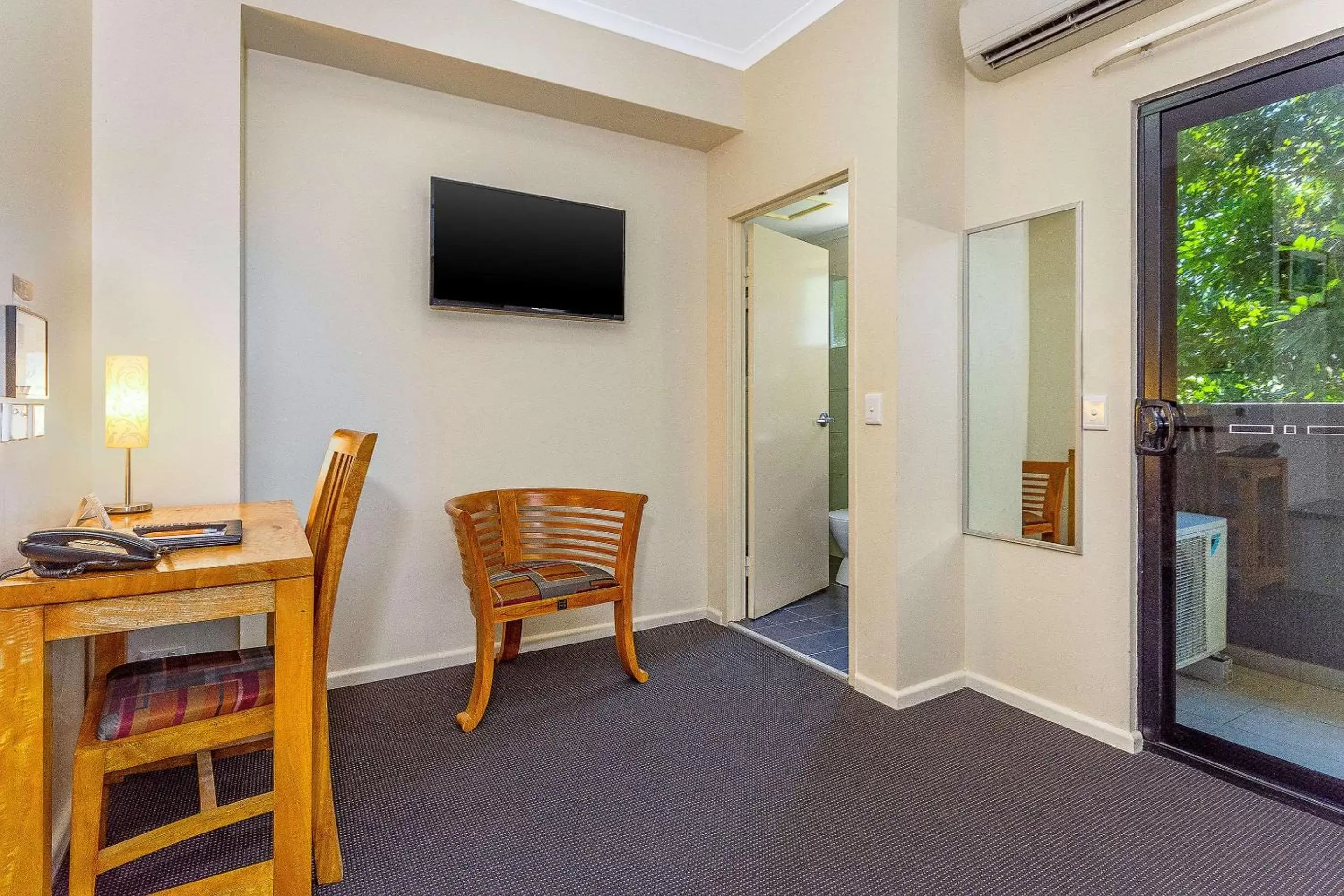 Photo of the whole room, TV/Entertainment Center in Quality Hotel Darwin Airport