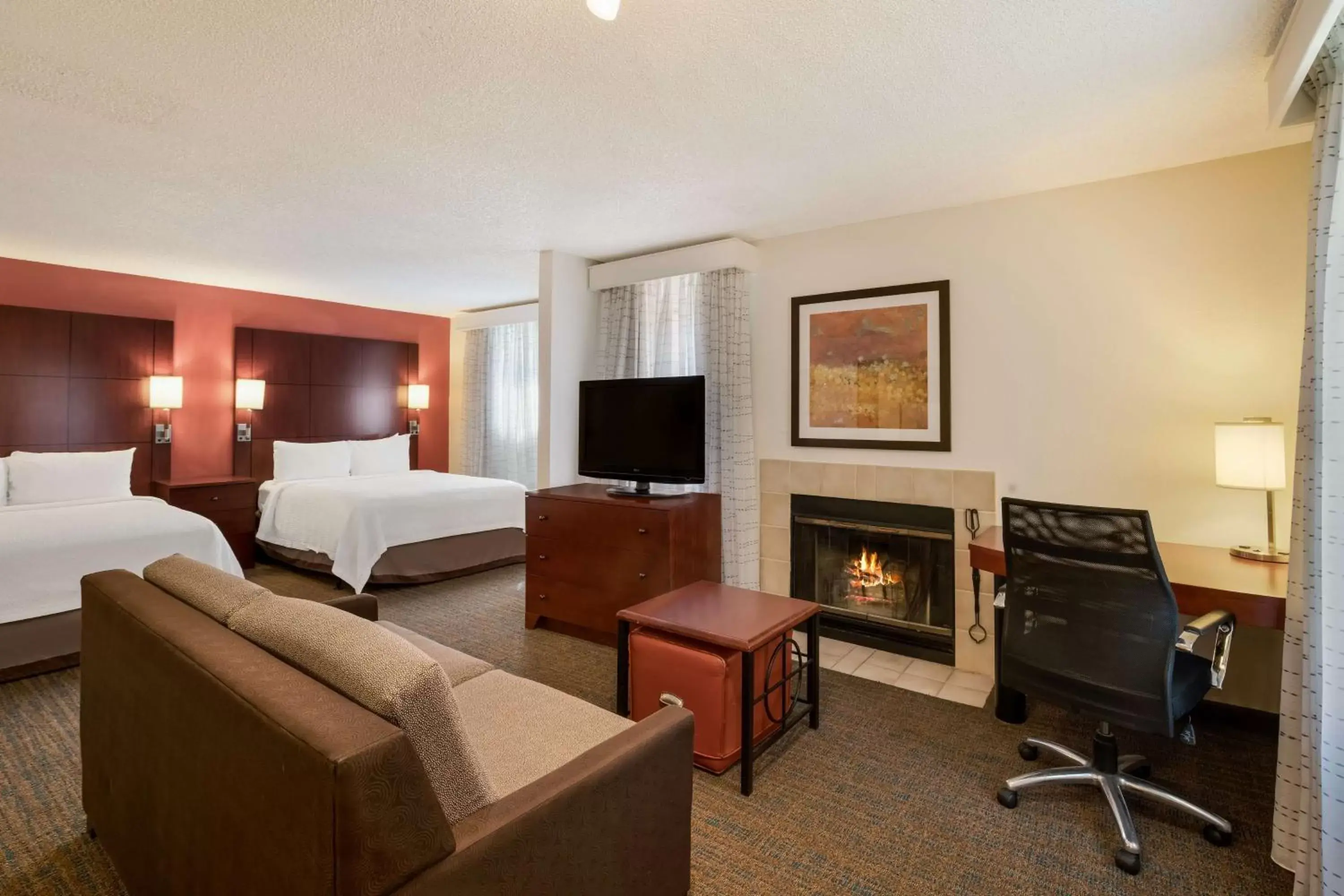 Bedroom, TV/Entertainment Center in SenS Suites Livermore; SureStay Collection by Best Western