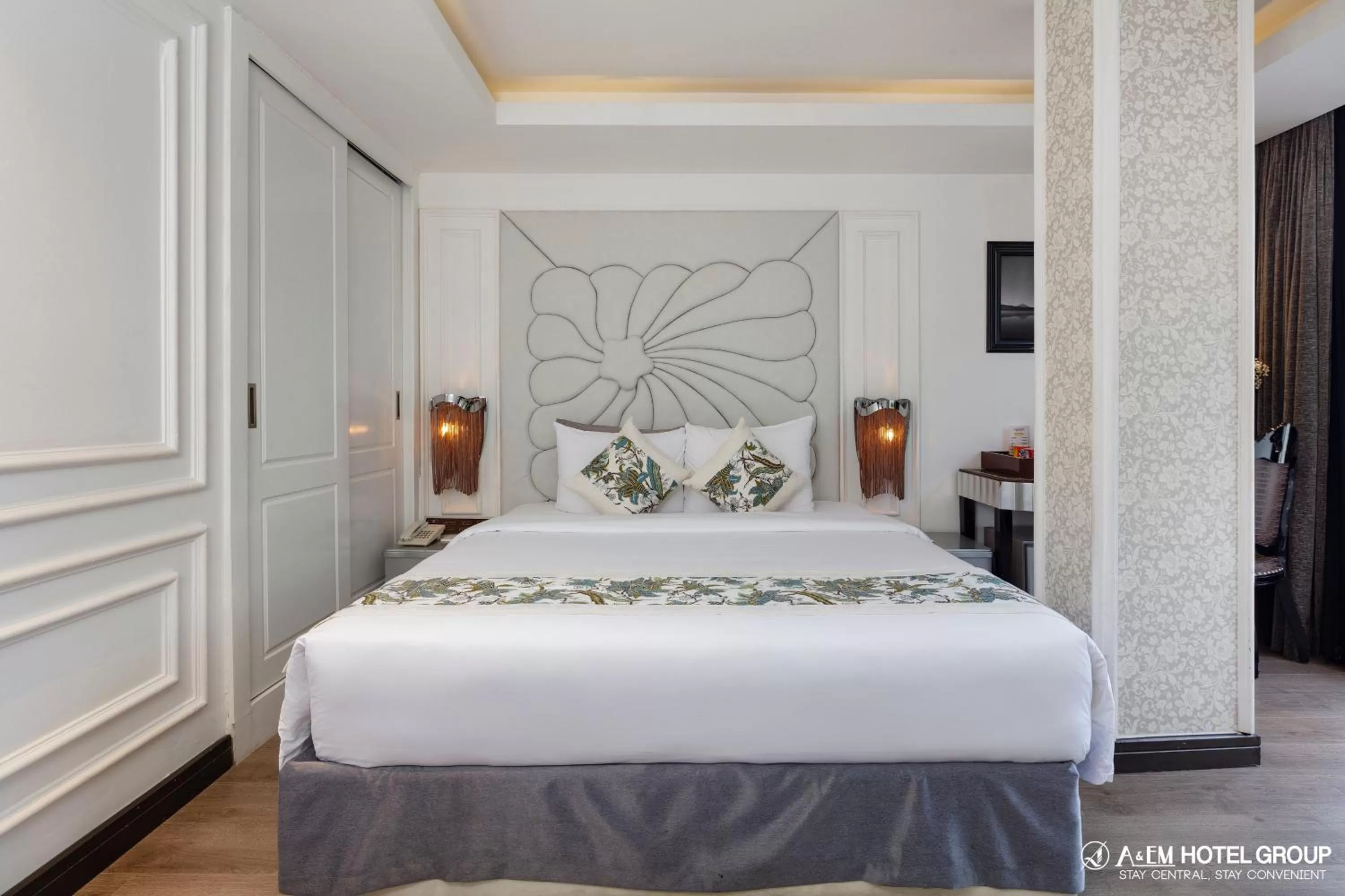 Bed in A&EM Saigon Hotel