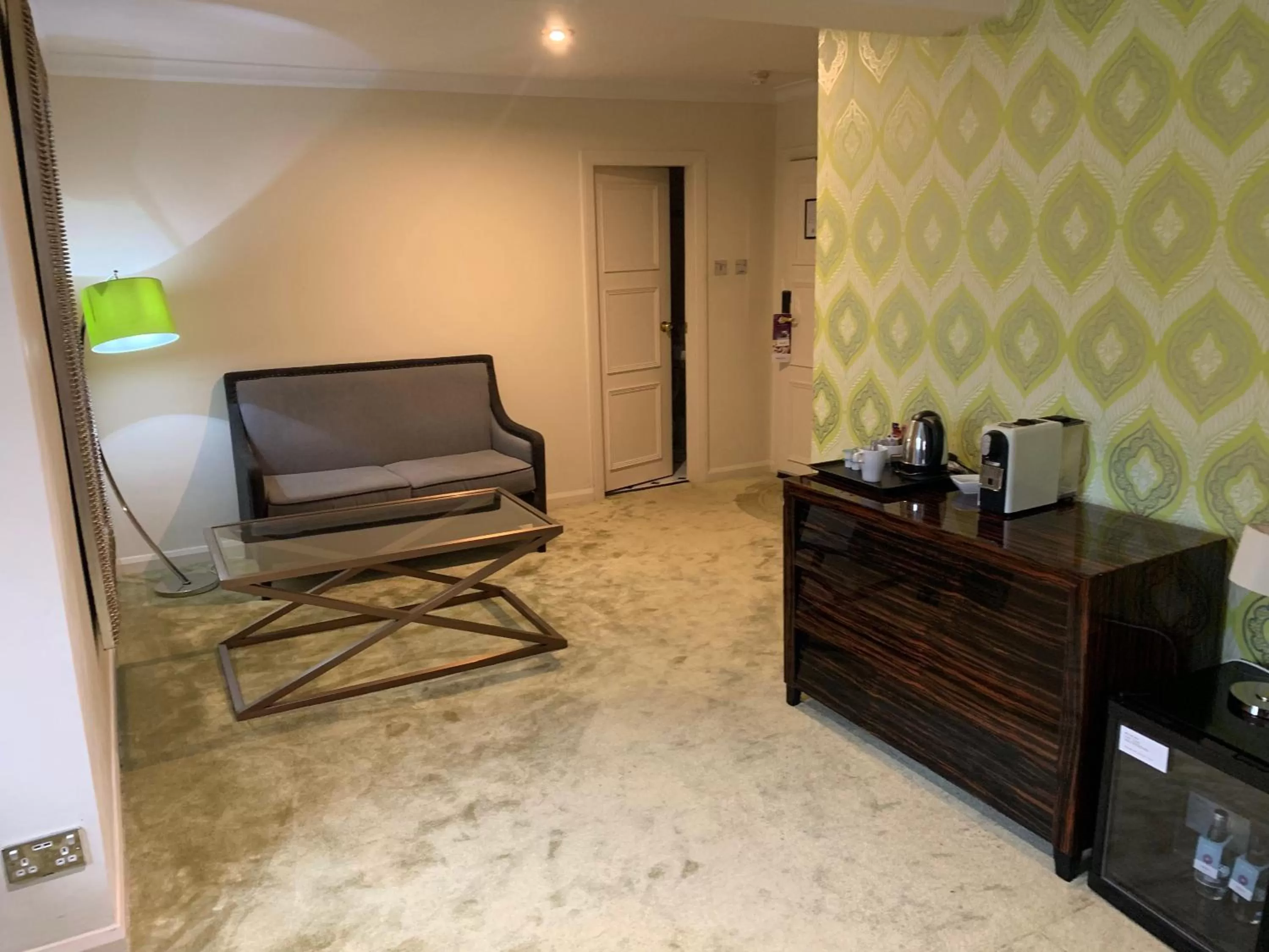 Communal lounge/ TV room in Barons Court Hotel Walsall