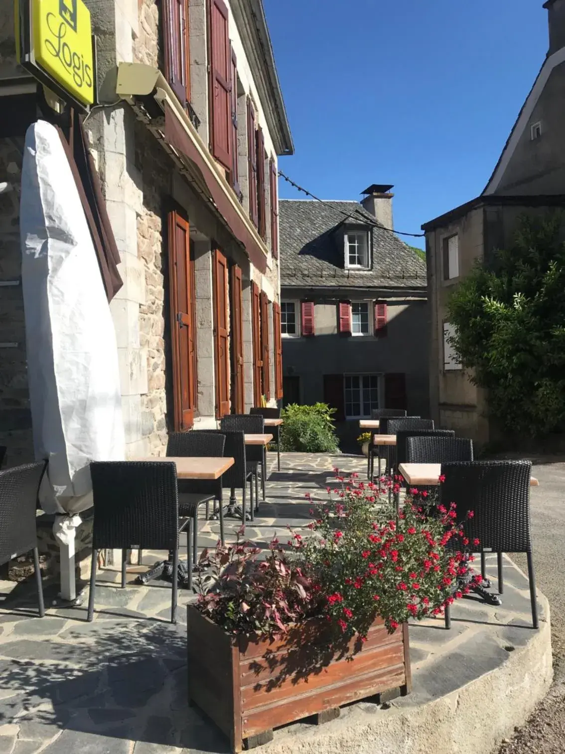 Patio, Property Building in Logis Hôtel Les Coudercous