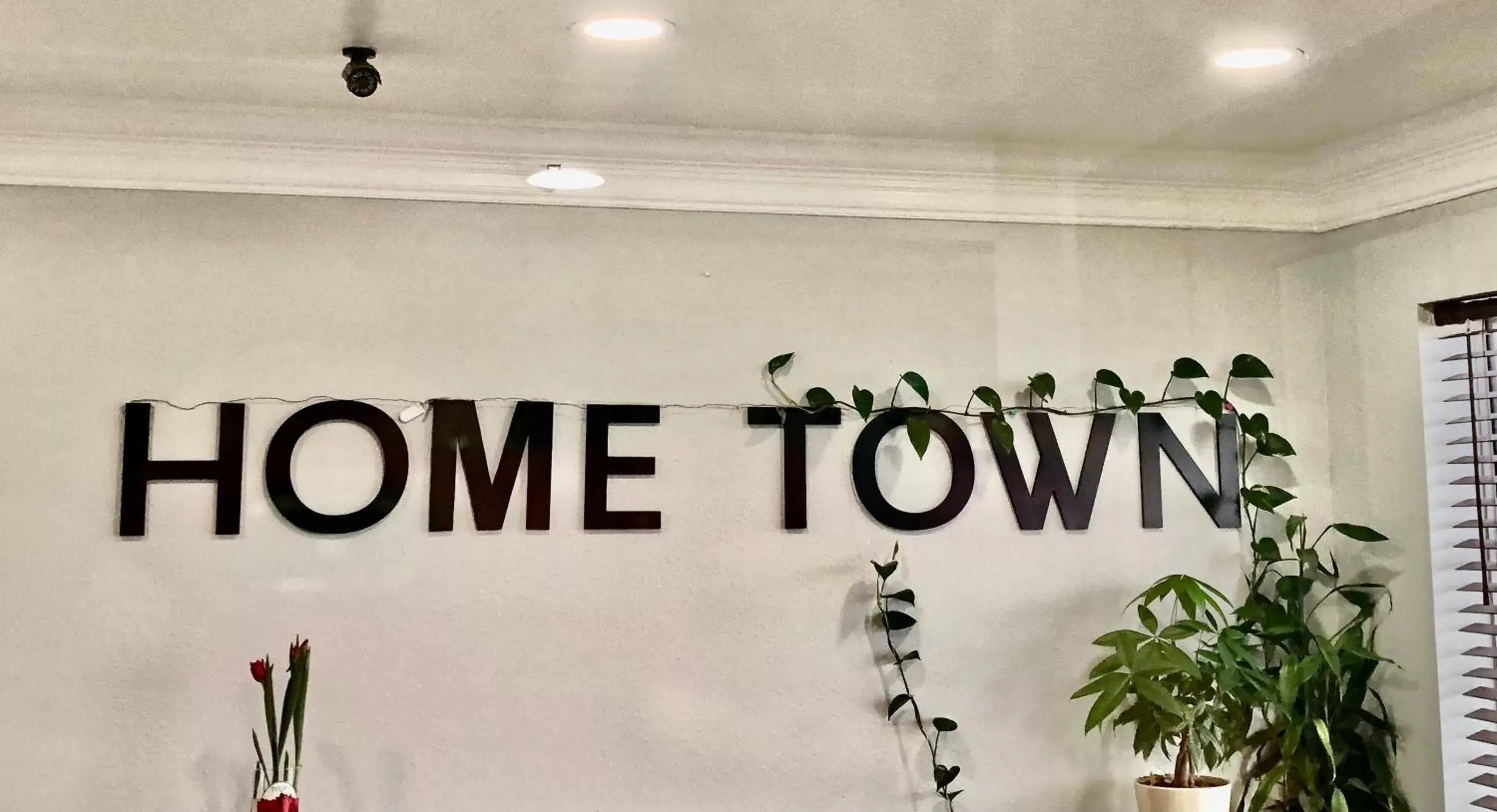 Property logo or sign in Hometown Inn Airport