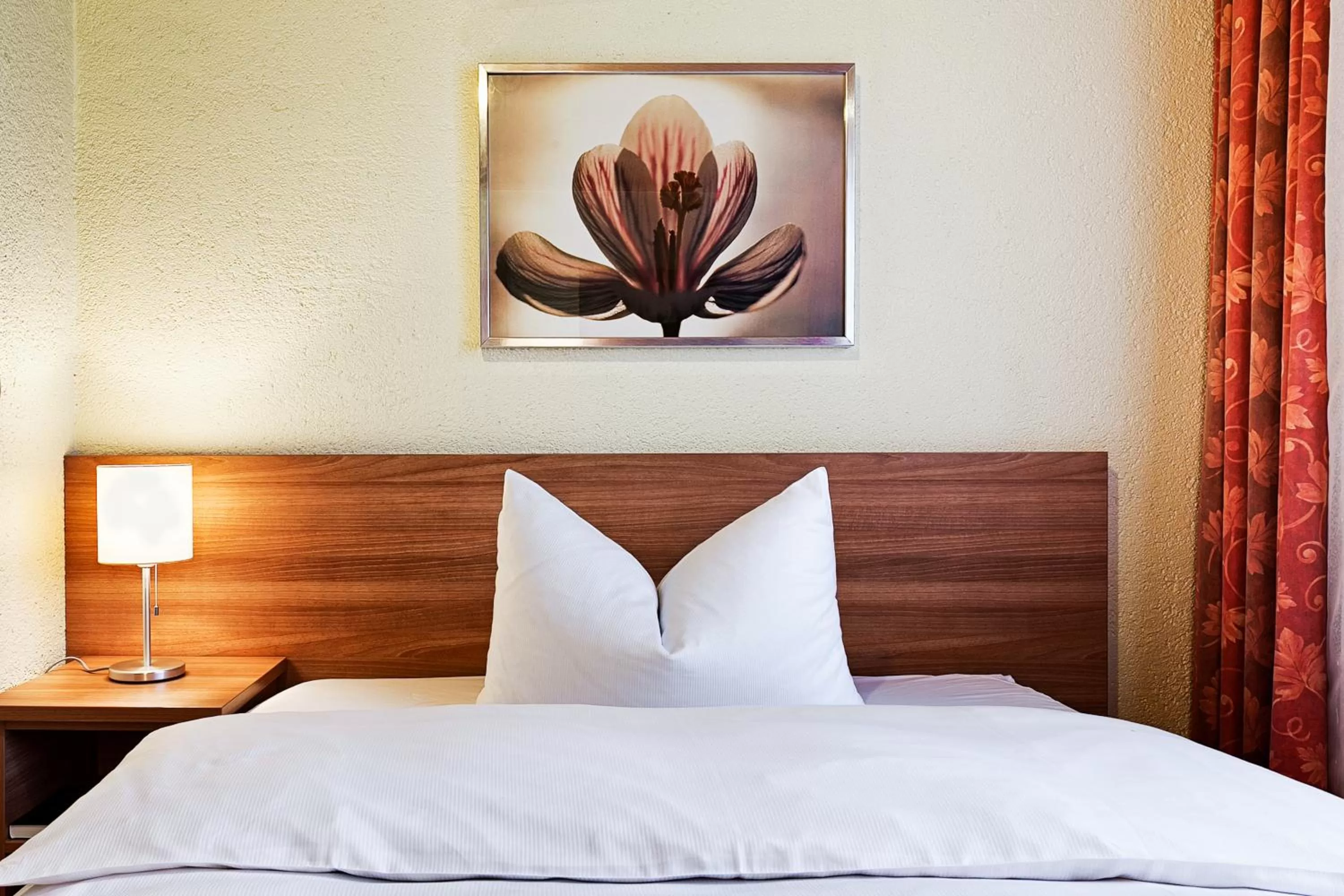 Bed in Nürnberger Trichter Family-Business Hotel Garni