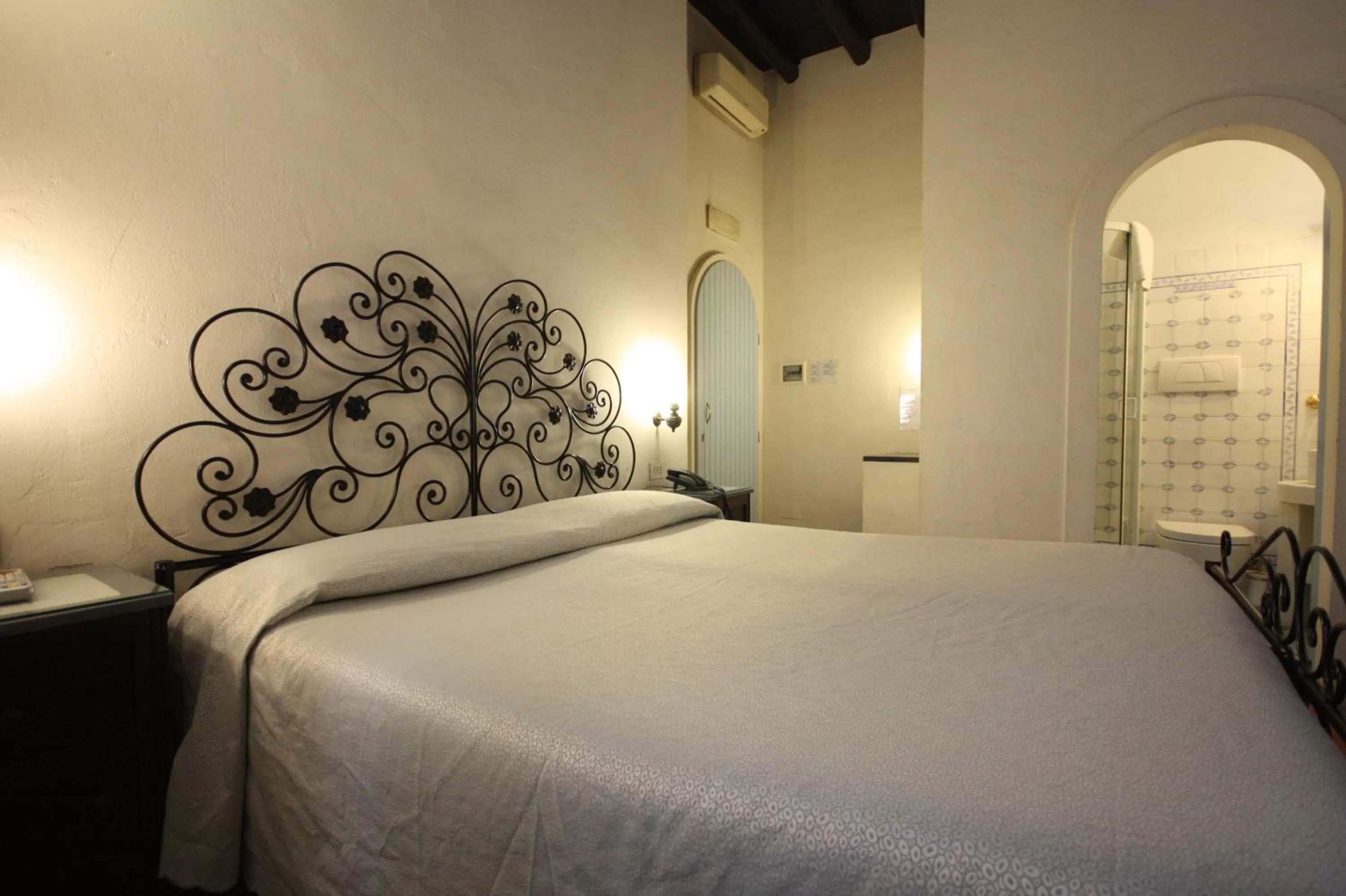 Bed in Hotel Cherubini