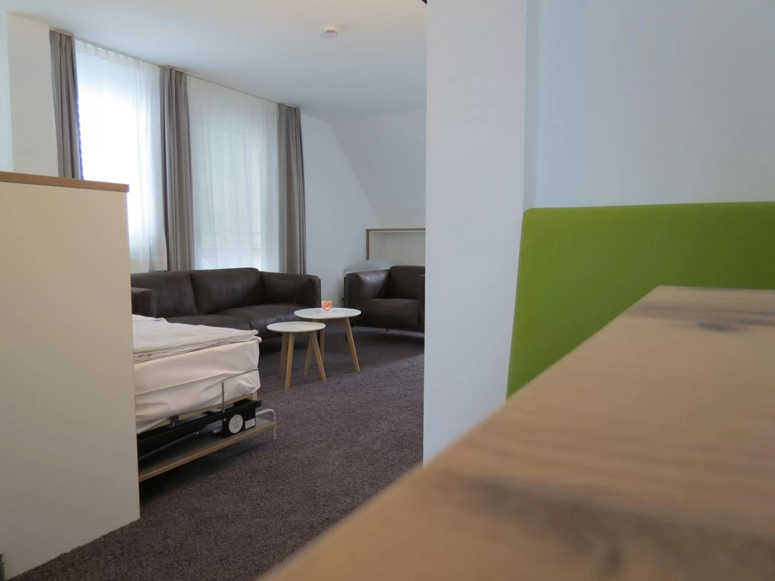 Living room, Bed in Comfor Hotel Ulm City