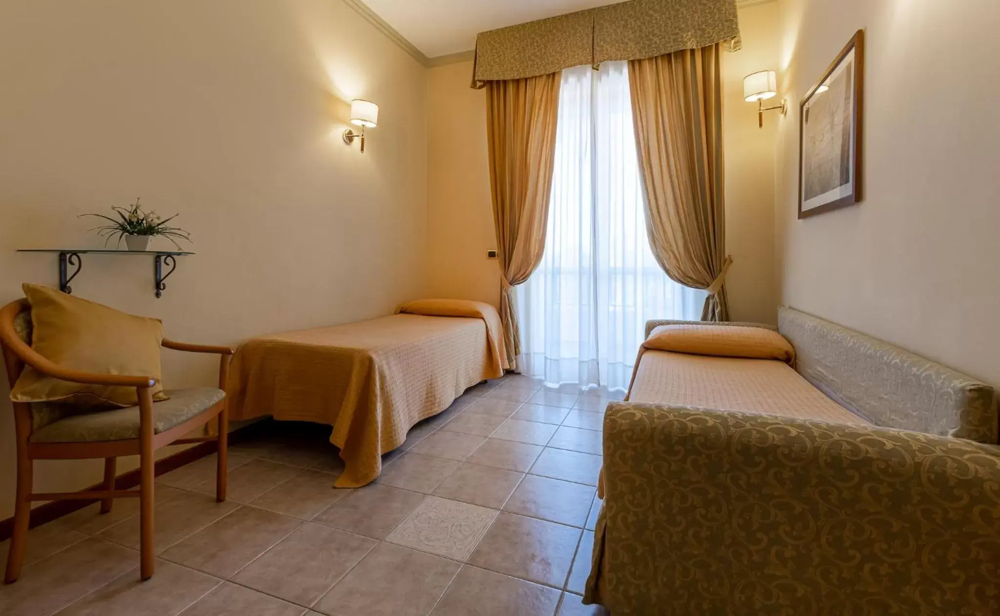 Bed, Seating Area in Hotel Relax