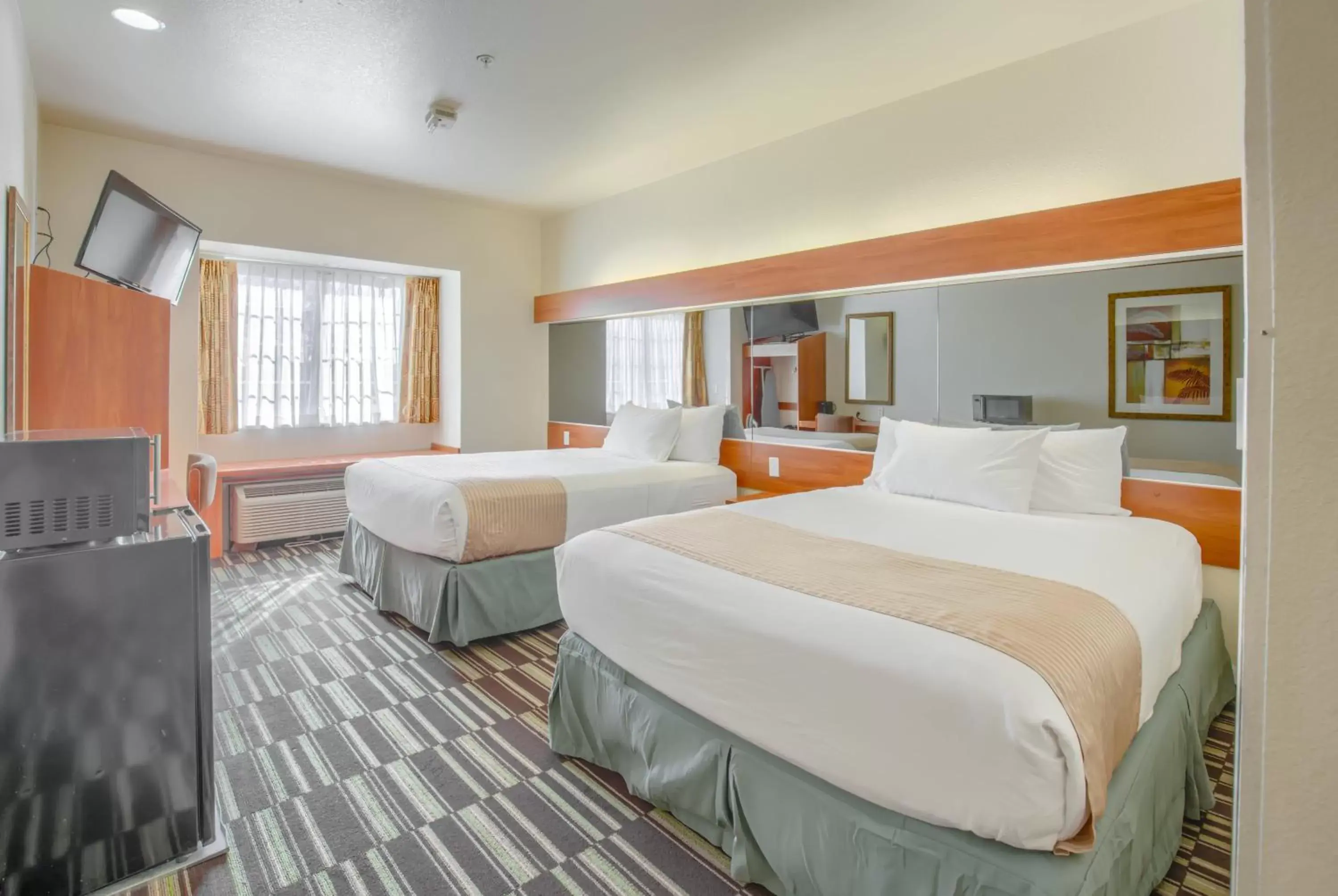 Bed in Microtel Inn & Suites by Wyndham Gulf Shores