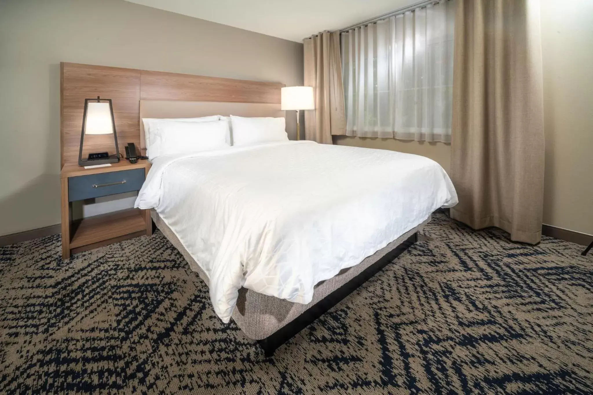 Bed in Candlewood Suites Charleston – Mt. Pleasant by IHG Bed in Candlewood Suites Charleston – Mt. Pleasant by IHG