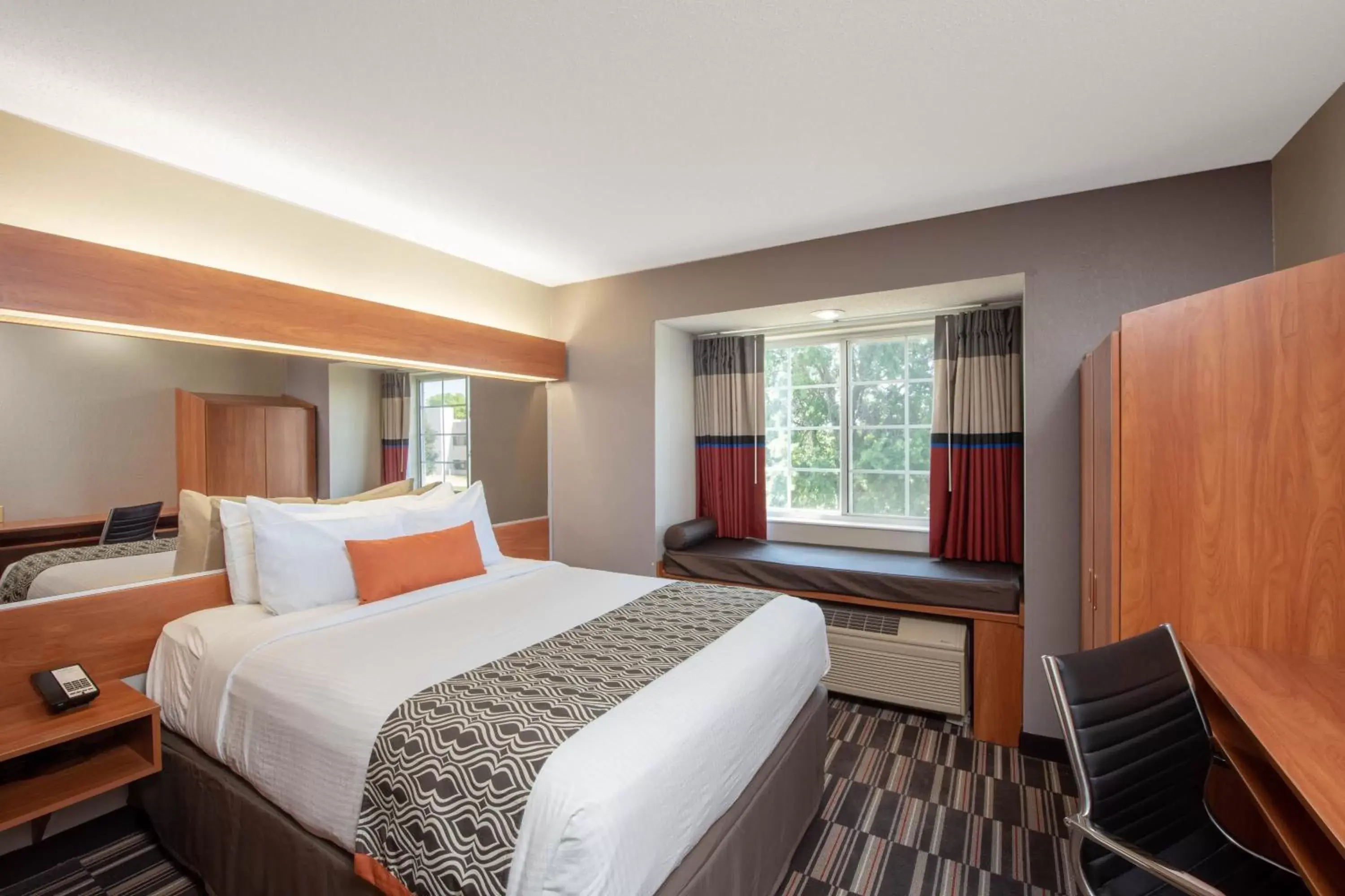 Bed in Microtel Inn & Suites by Wyndham Springfield