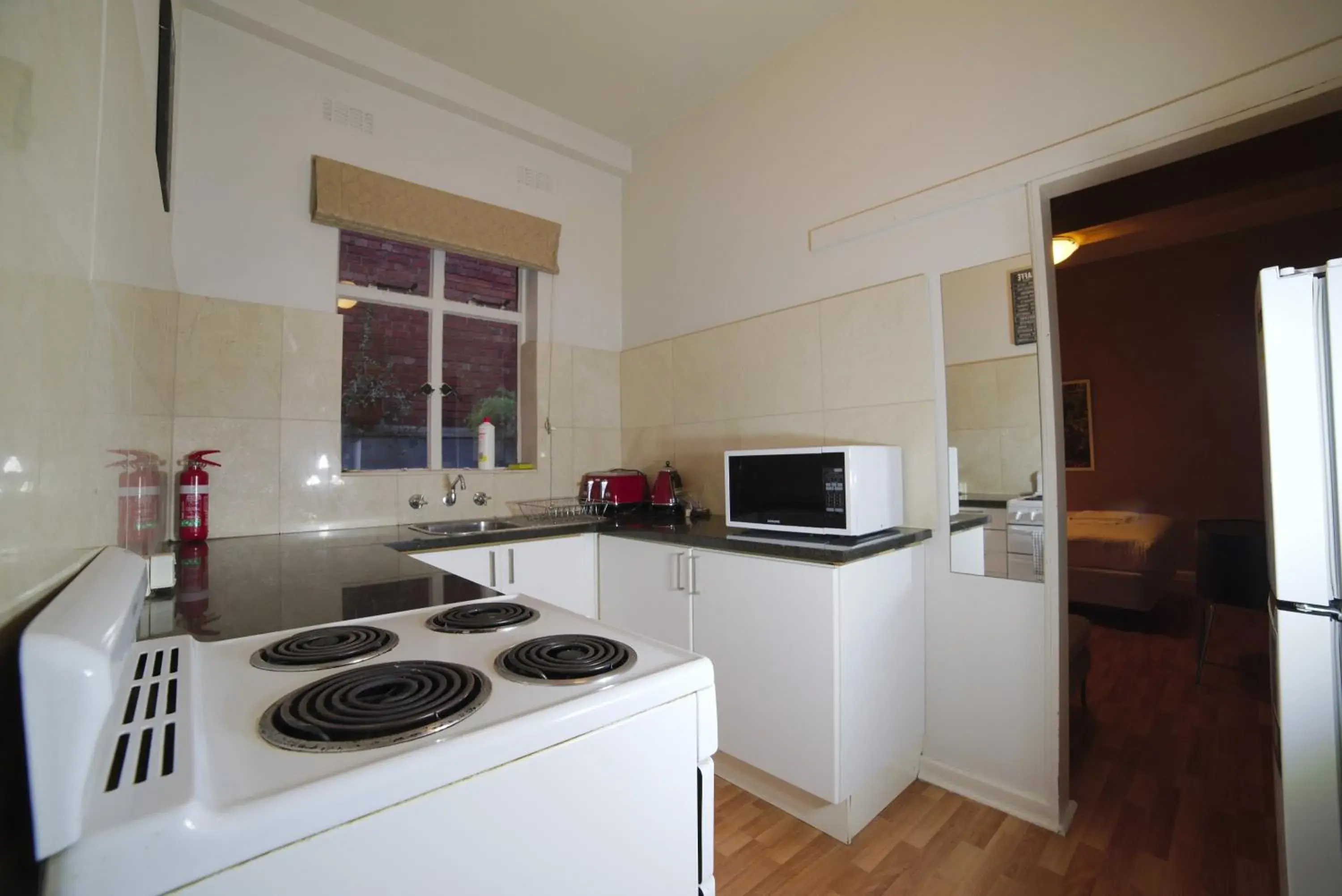 Photo of the whole room, Kitchen/Kitchenette in City Centre Budget Hotel