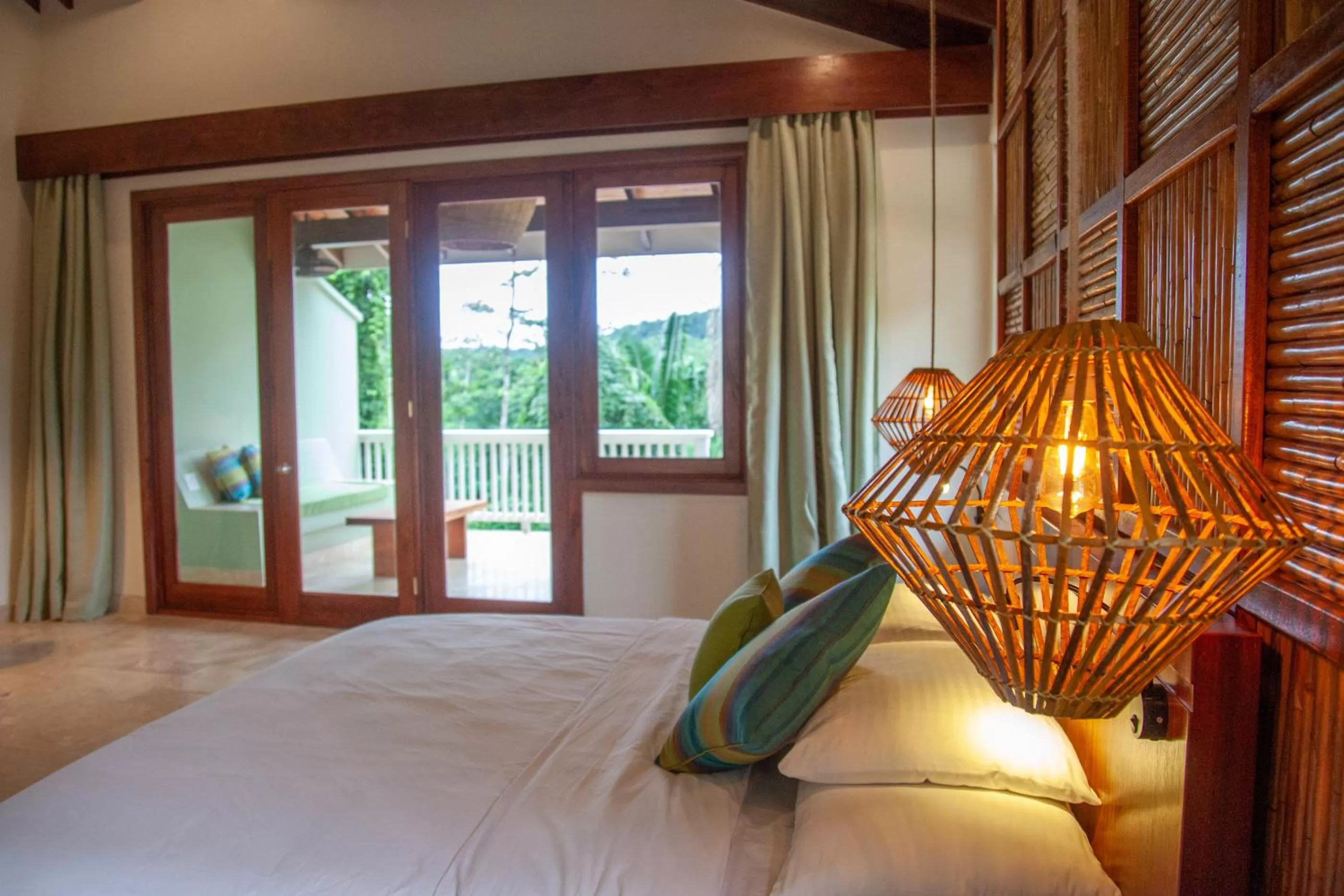 Bed in Sleeping Giant Rainforest Lodge