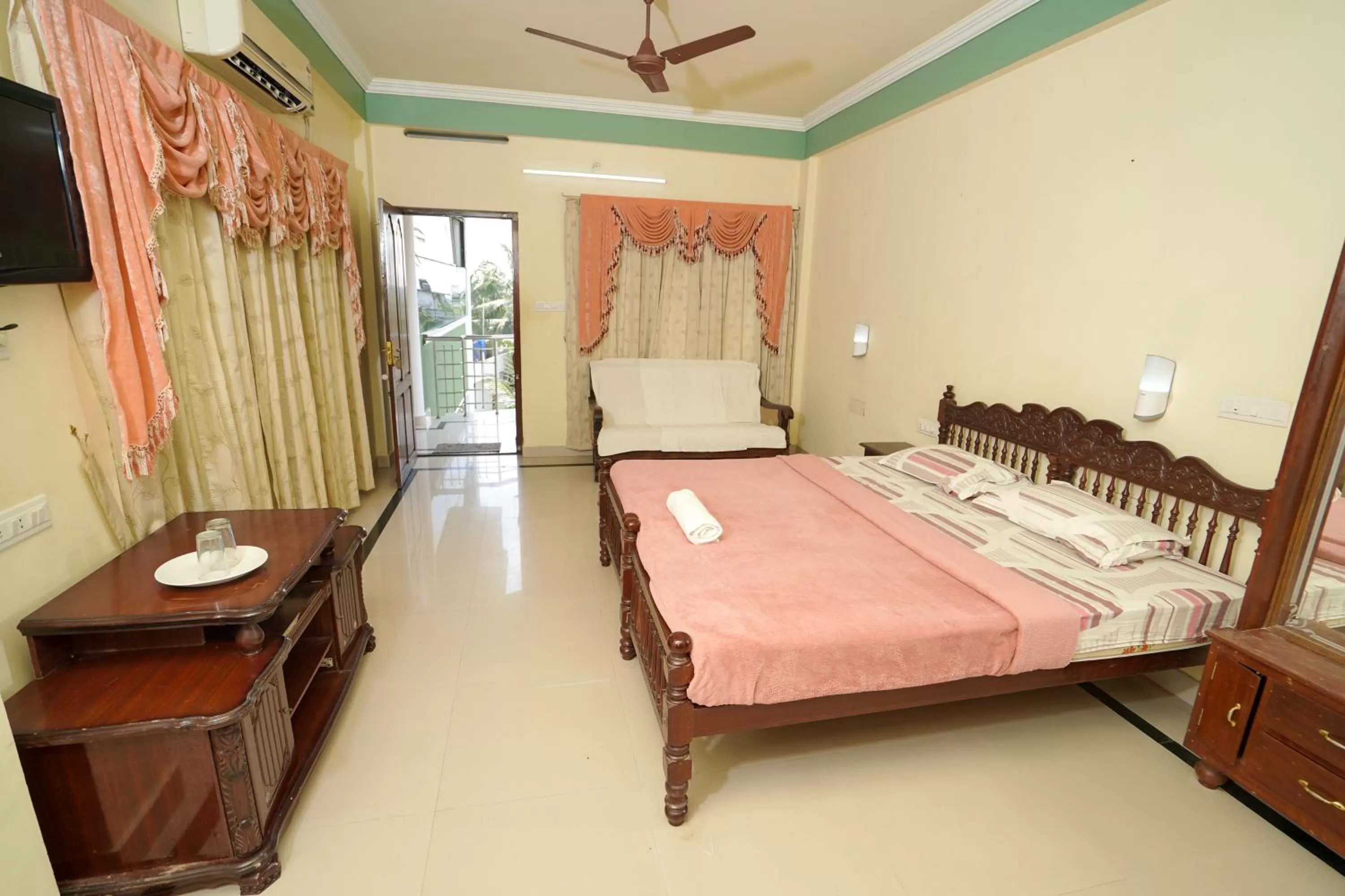 Bed in Sree Mookambika Beach Resort