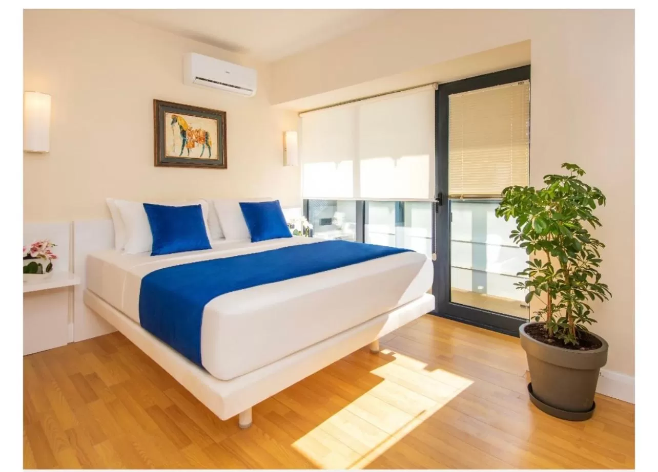 Bed in Orbi City Luxury Suite