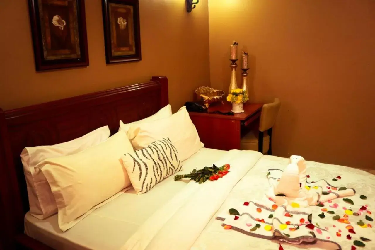 Bed in Tulia Boutique Hotel & Spa