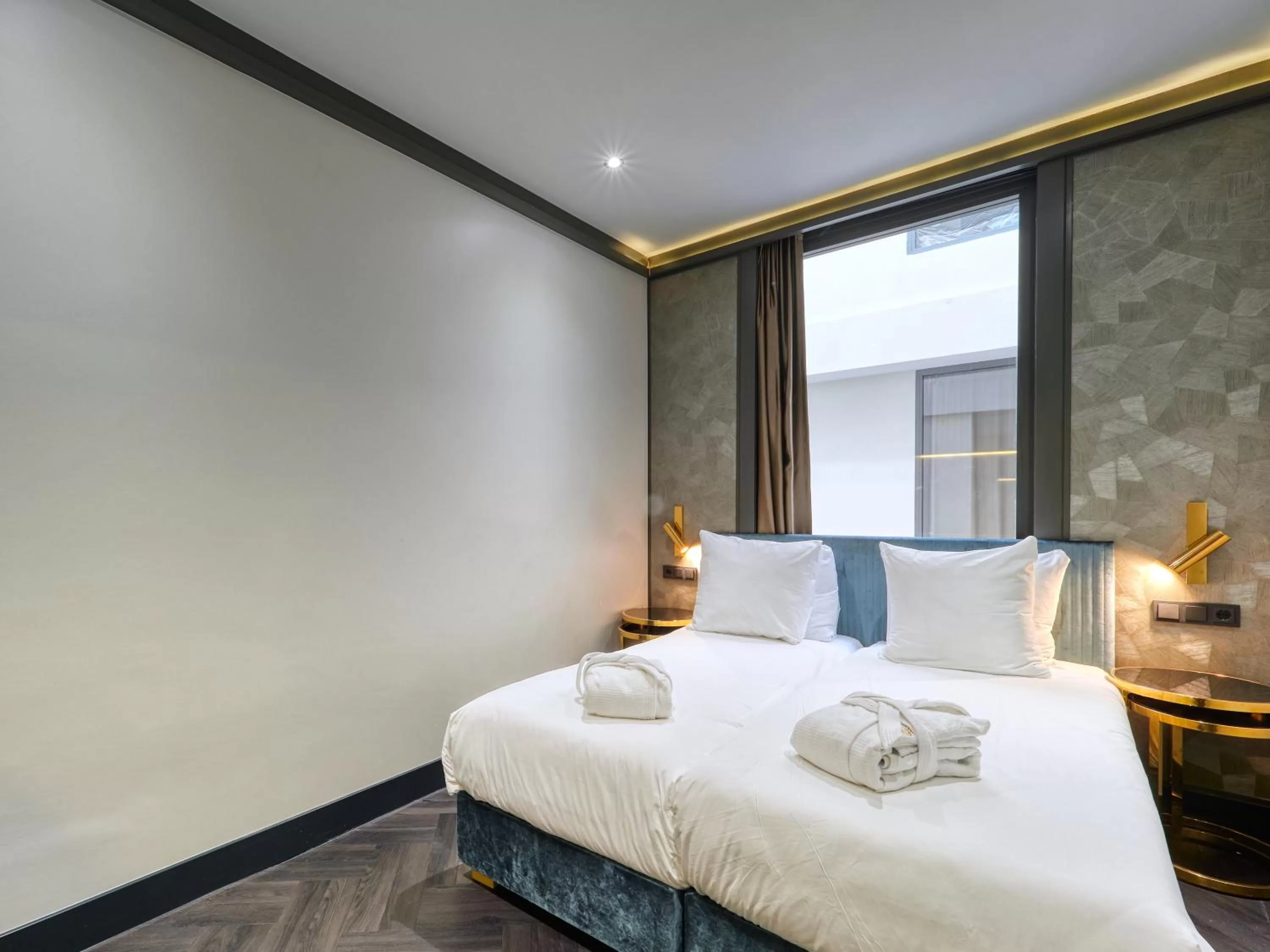 Bed in Triple G Hotels