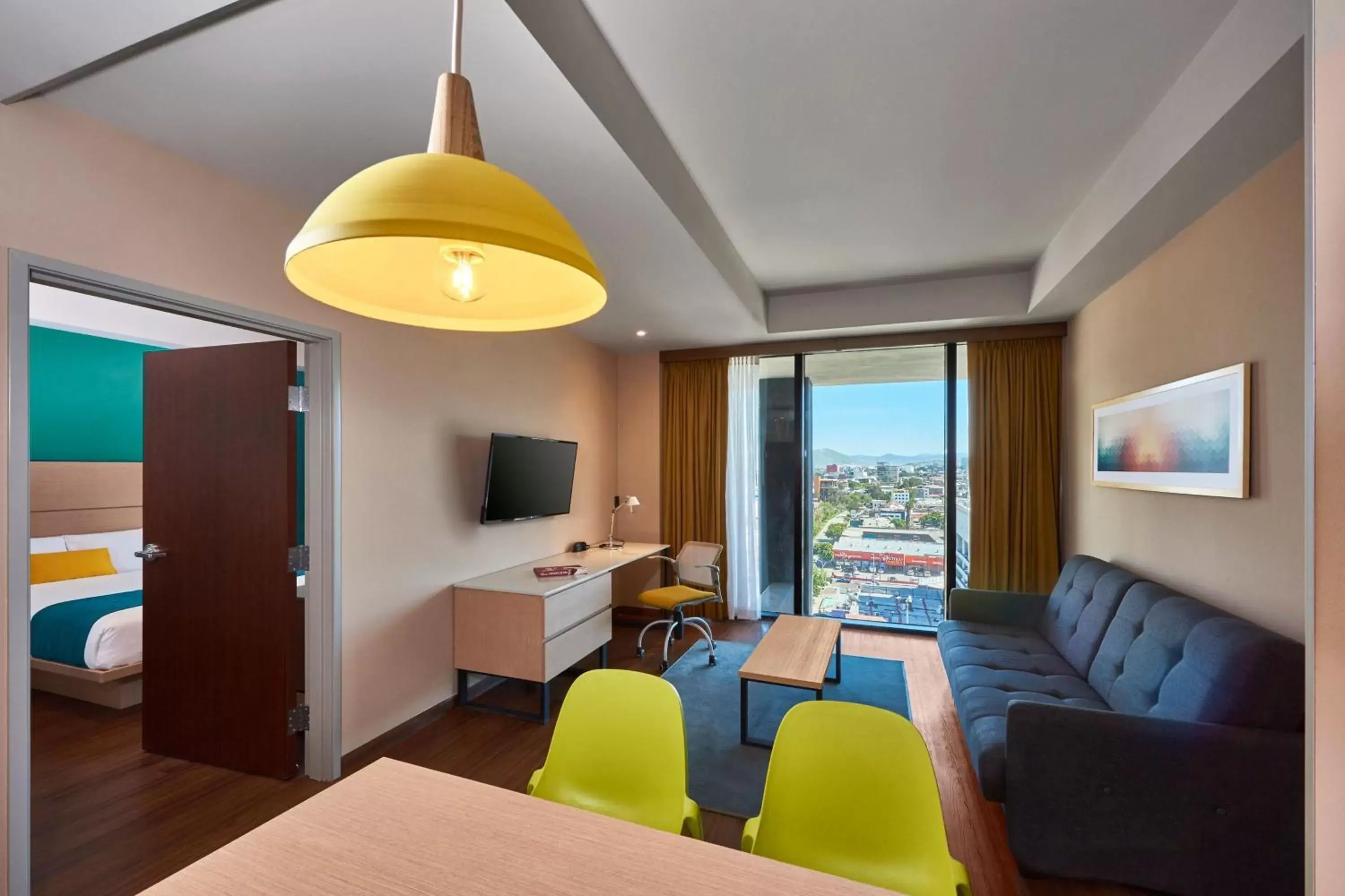 Photo of the whole room, Seating Area in City Express Suites by Marriott Tijuana Rio