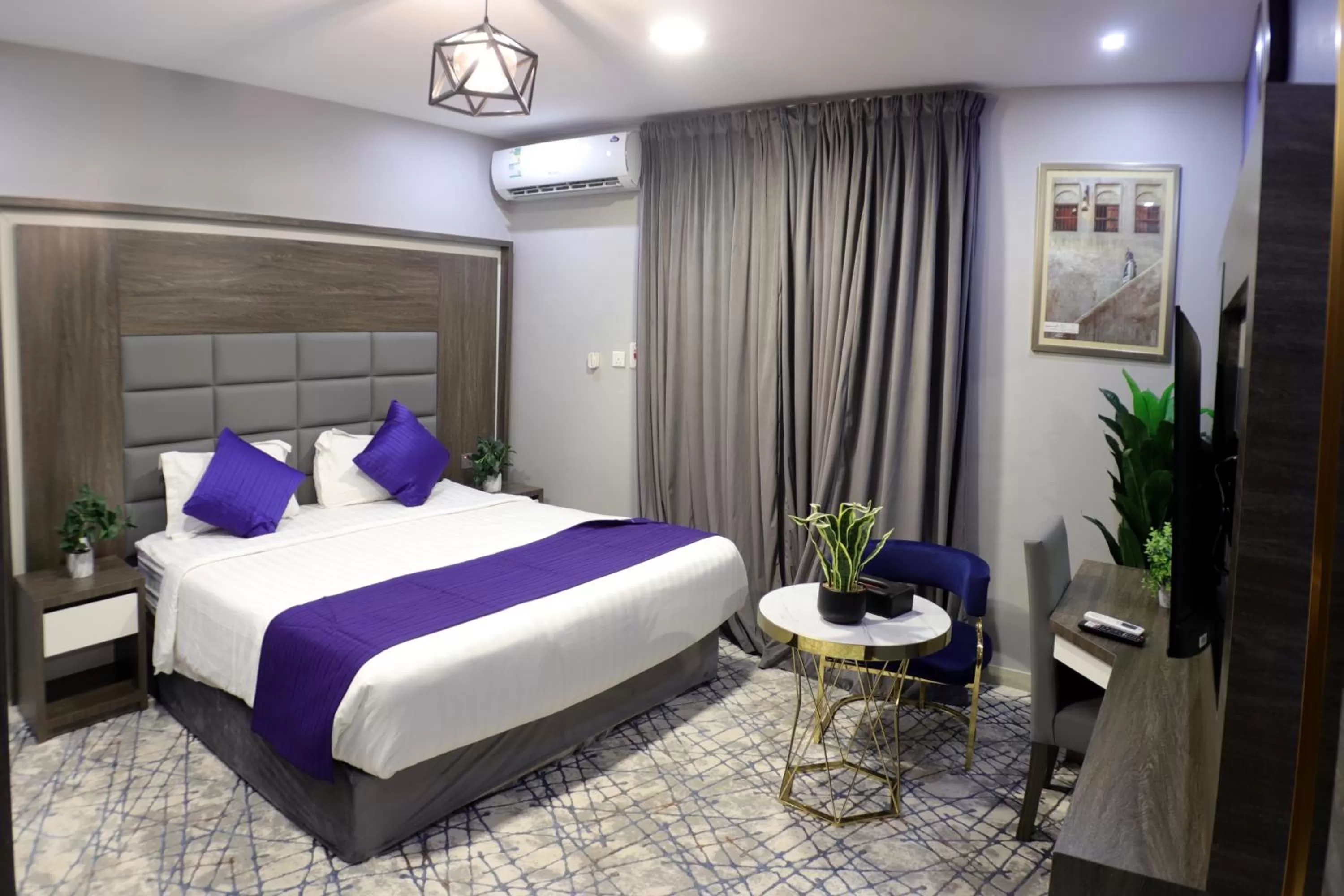Bed in Maskan Al Dyafah Hotel Apartments