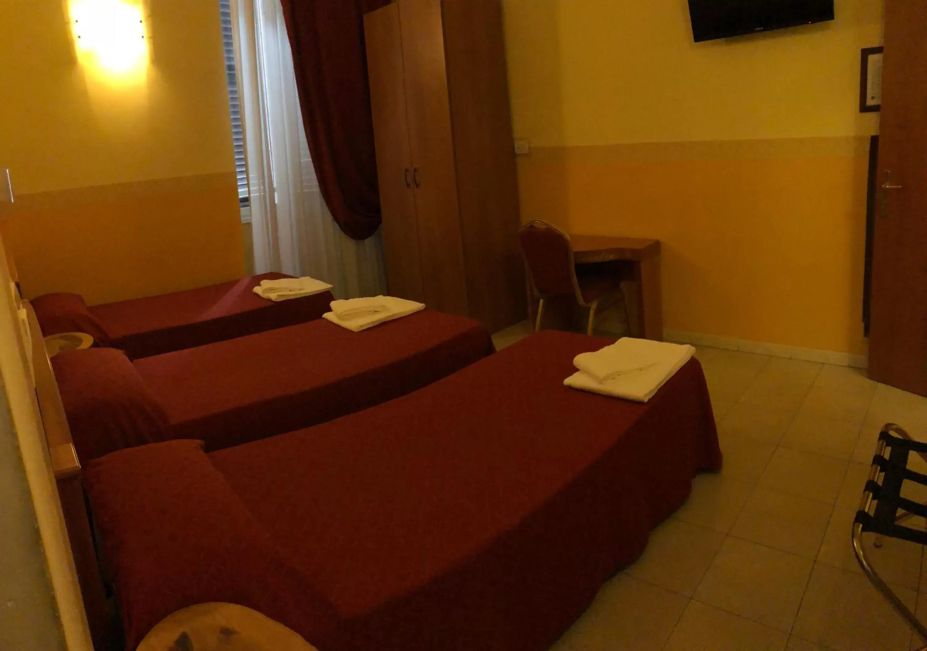 Bed in Hotel Cherubini