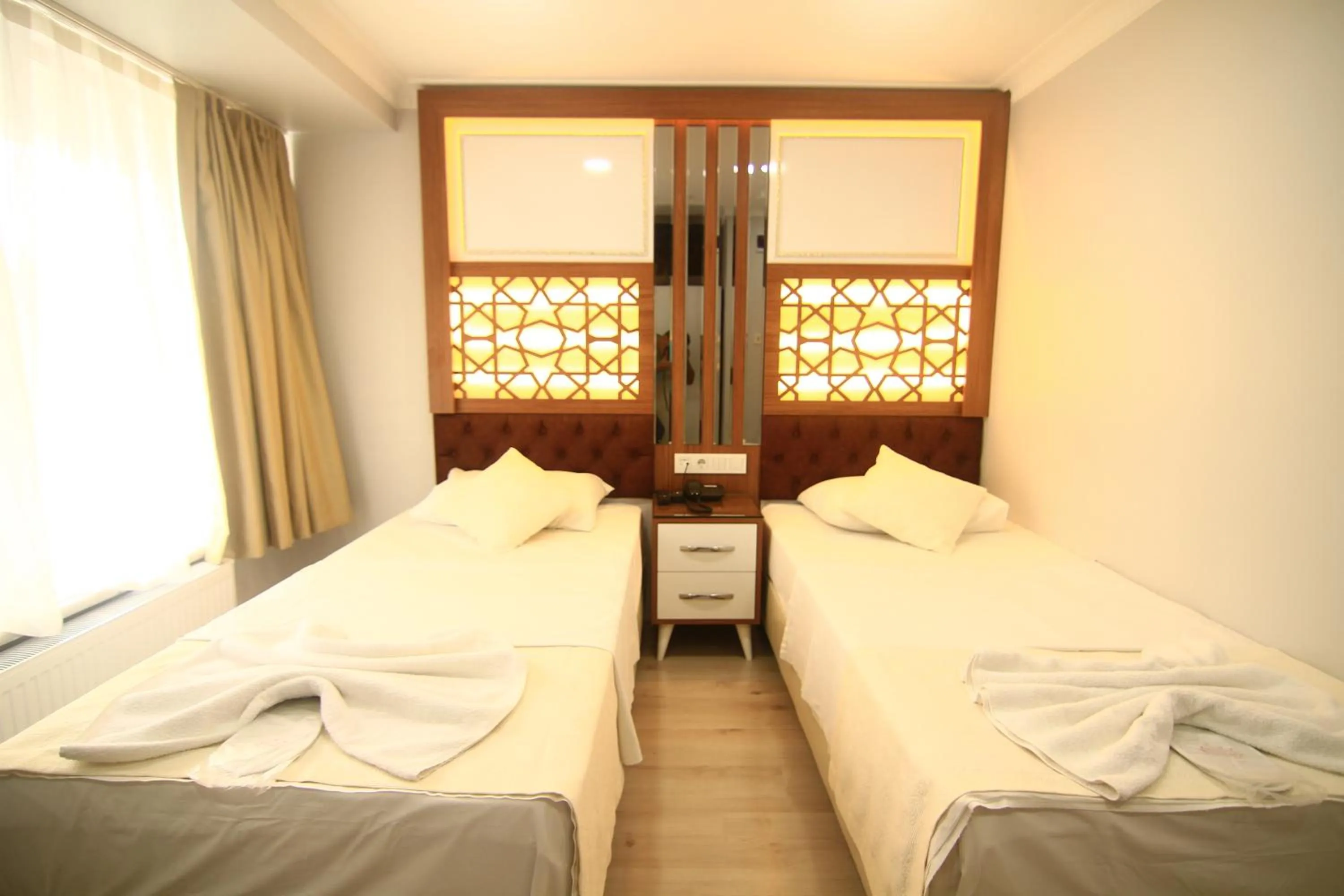 Bed in Grand Liza Hotel