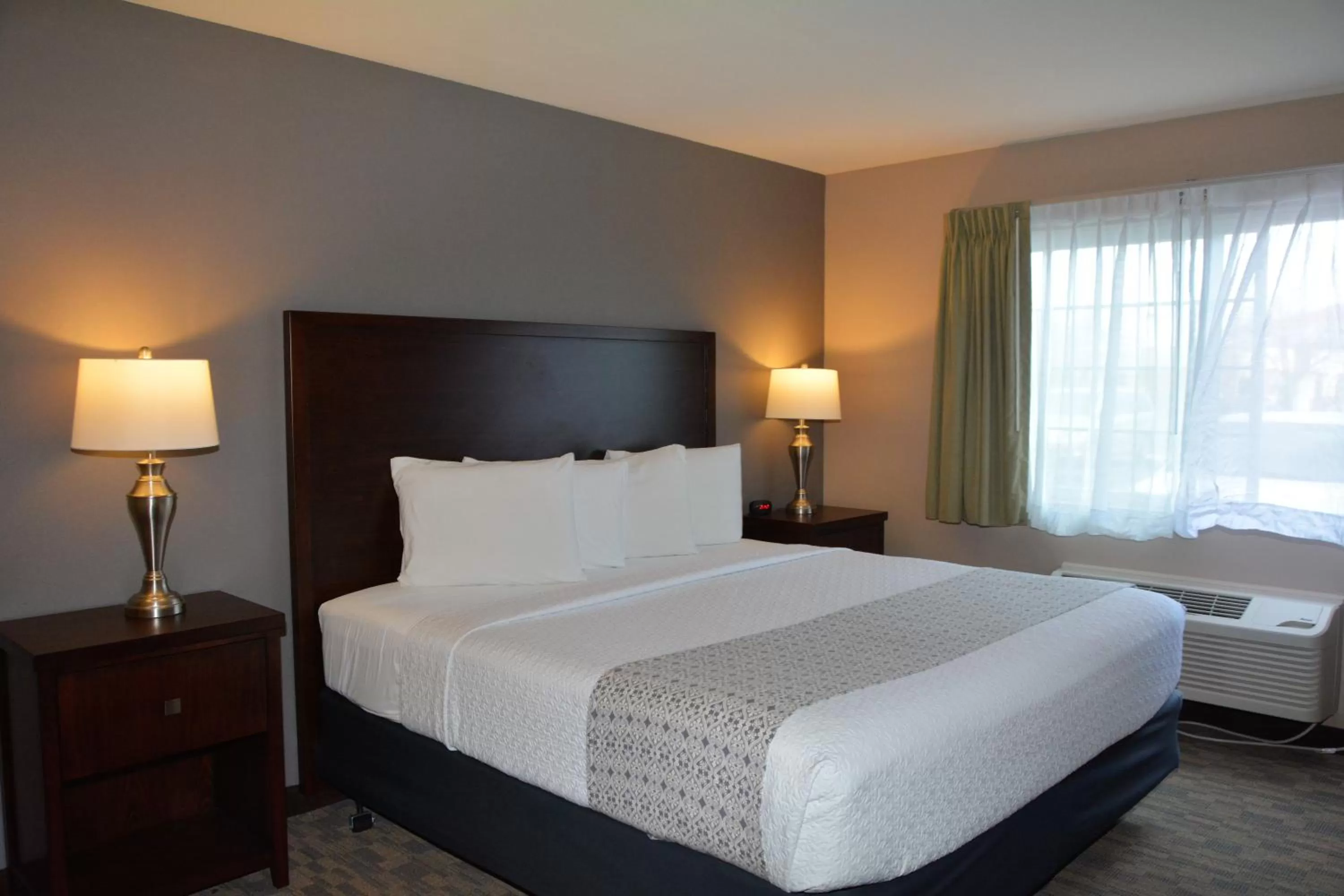 Bed in FairBridge Inn & Suites DuPont