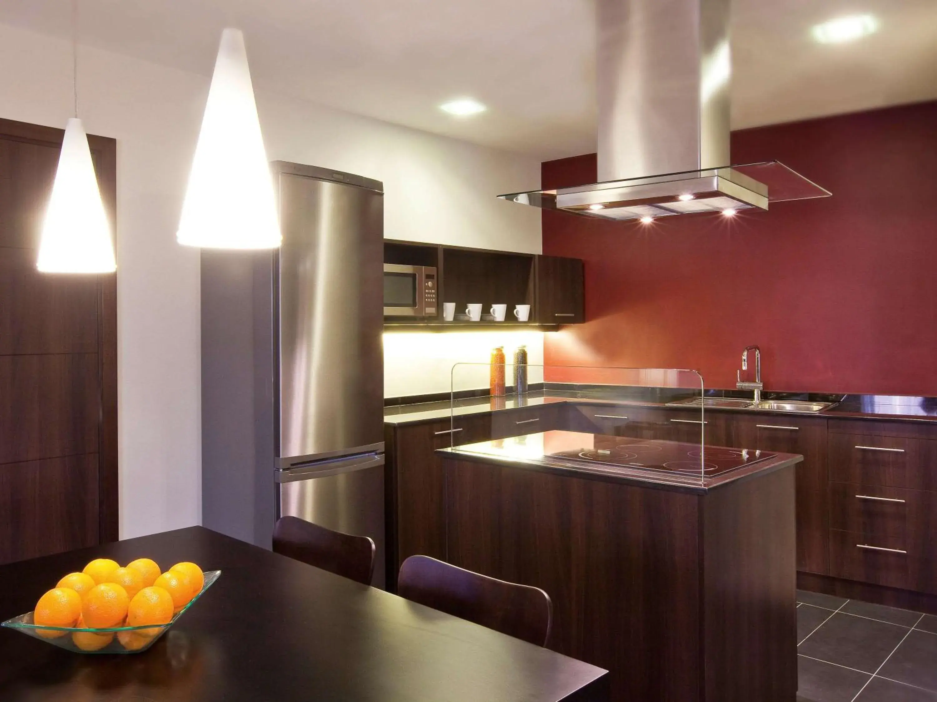 Photo of the whole room, Kitchen/Kitchenette in Moevenpick Hotel Apartments The Square