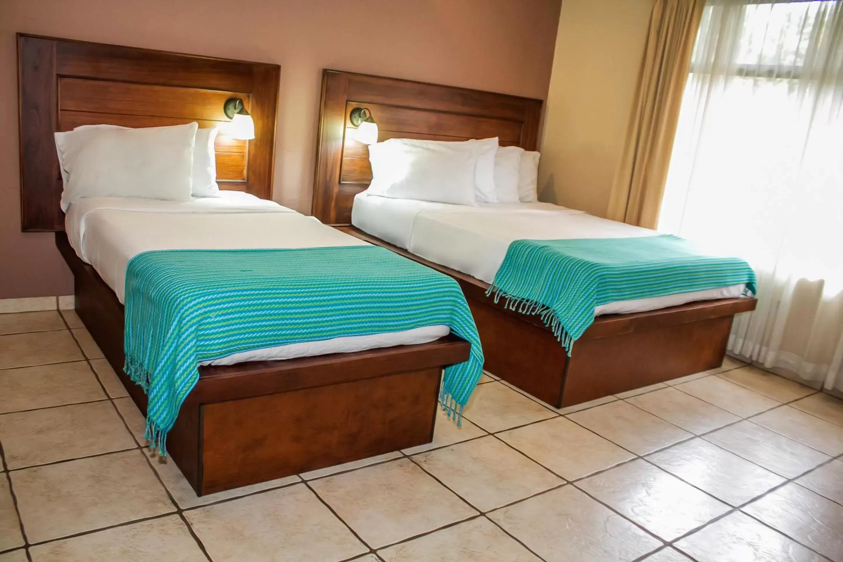 Bed in La Riviera Hotel