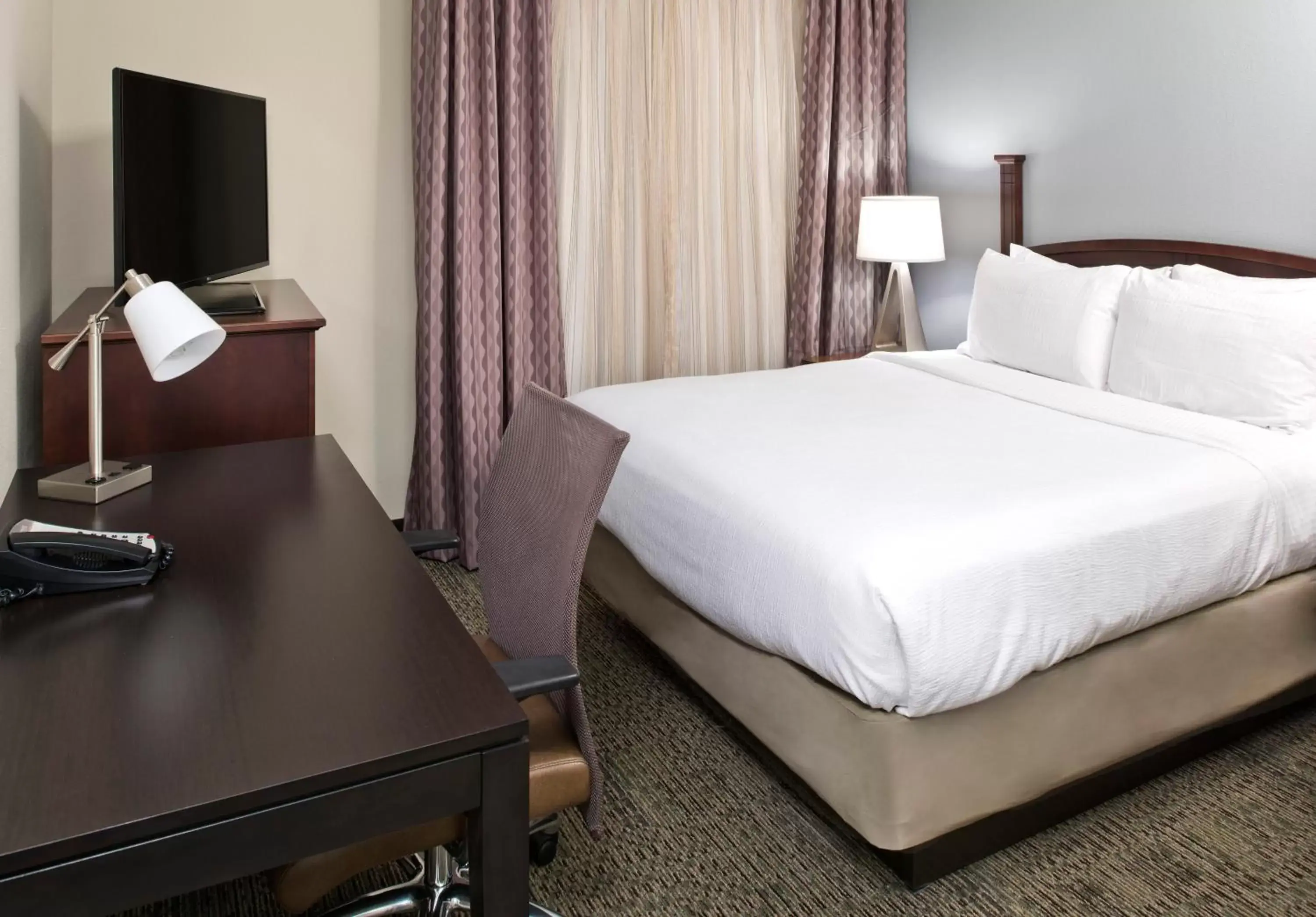 Bed in Staybridge Suites - Charlotte Ballantyne, an IHG Hotel