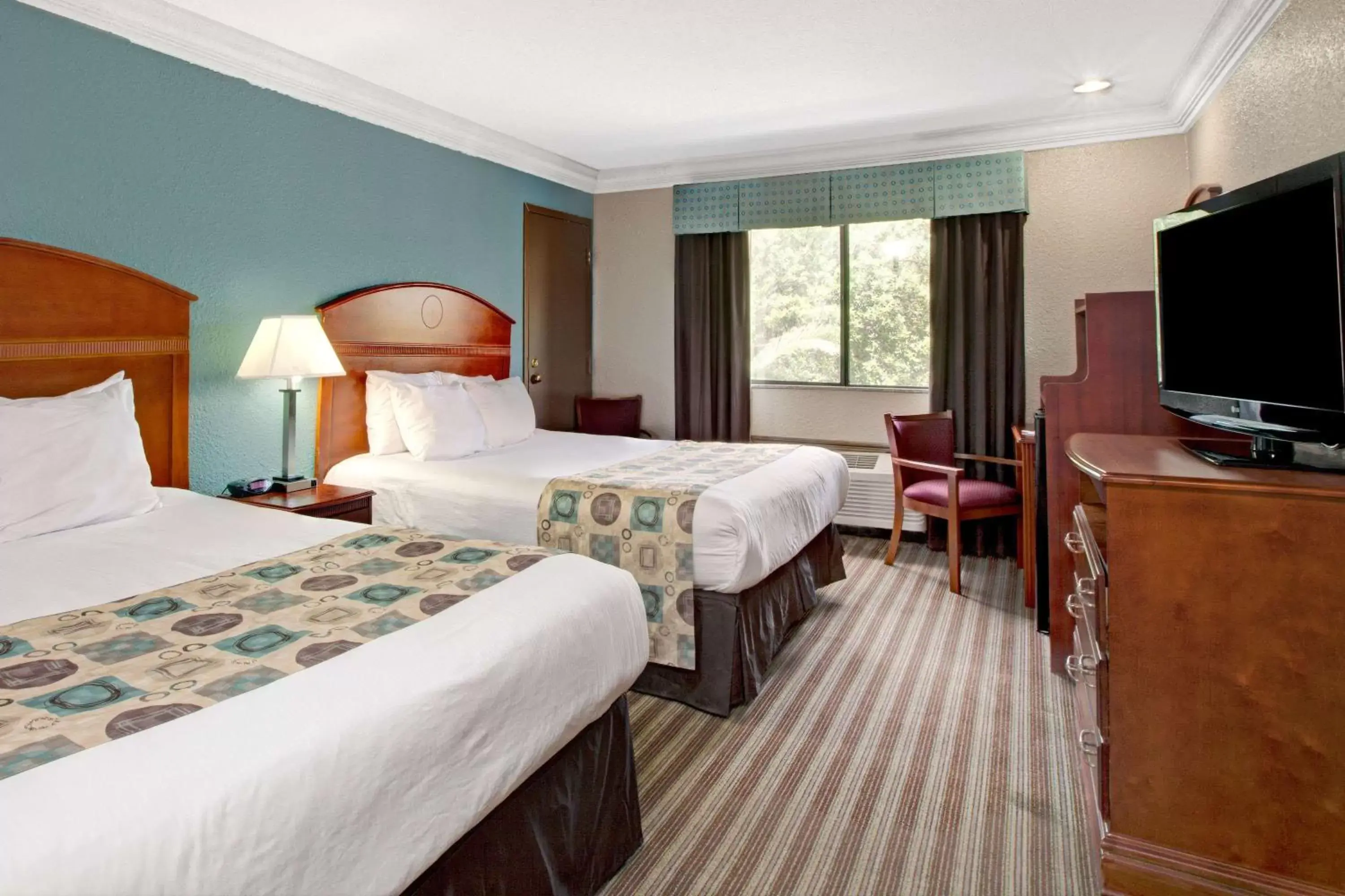 Photo of the whole room, Bed in Ramada by Wyndham Houston Intercontinental Airport South