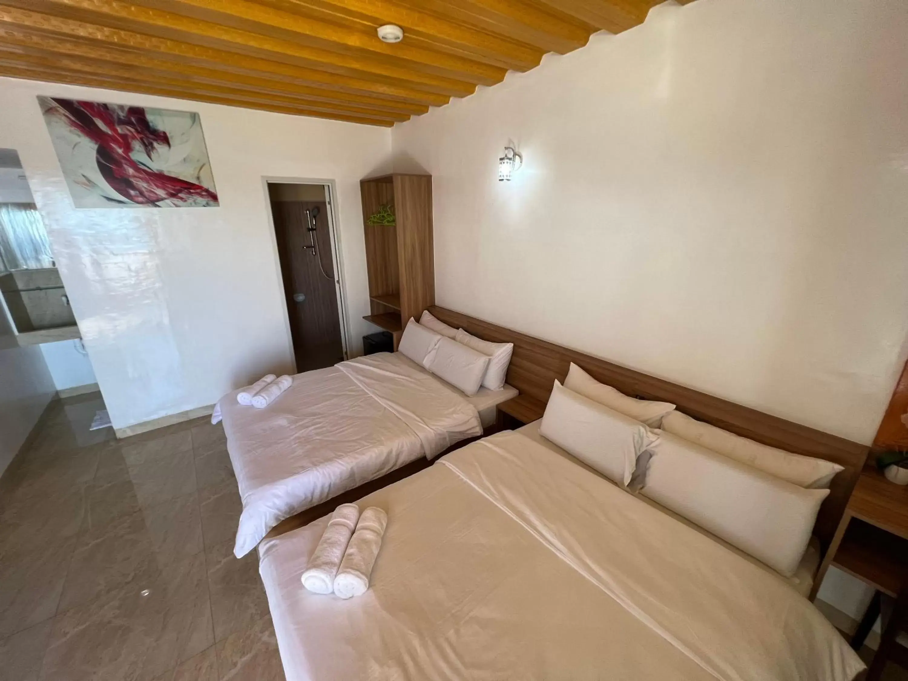 Bed in GingGing Hotel And Resort Bed in GingGing Hotel And Resort