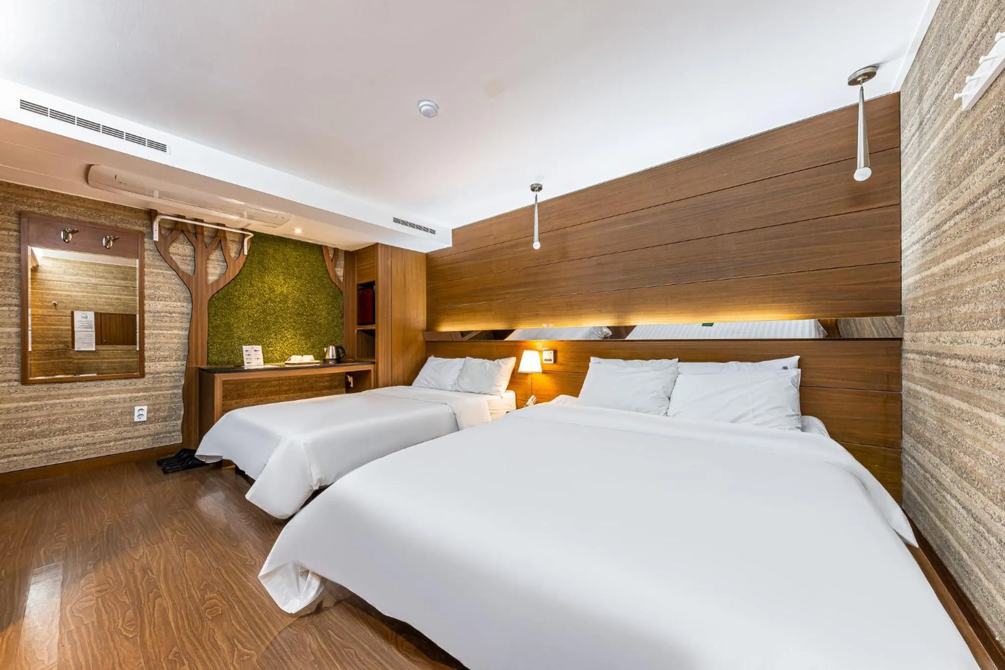 Bed in Friendly DH Naissance Hotel by Mindrum Group