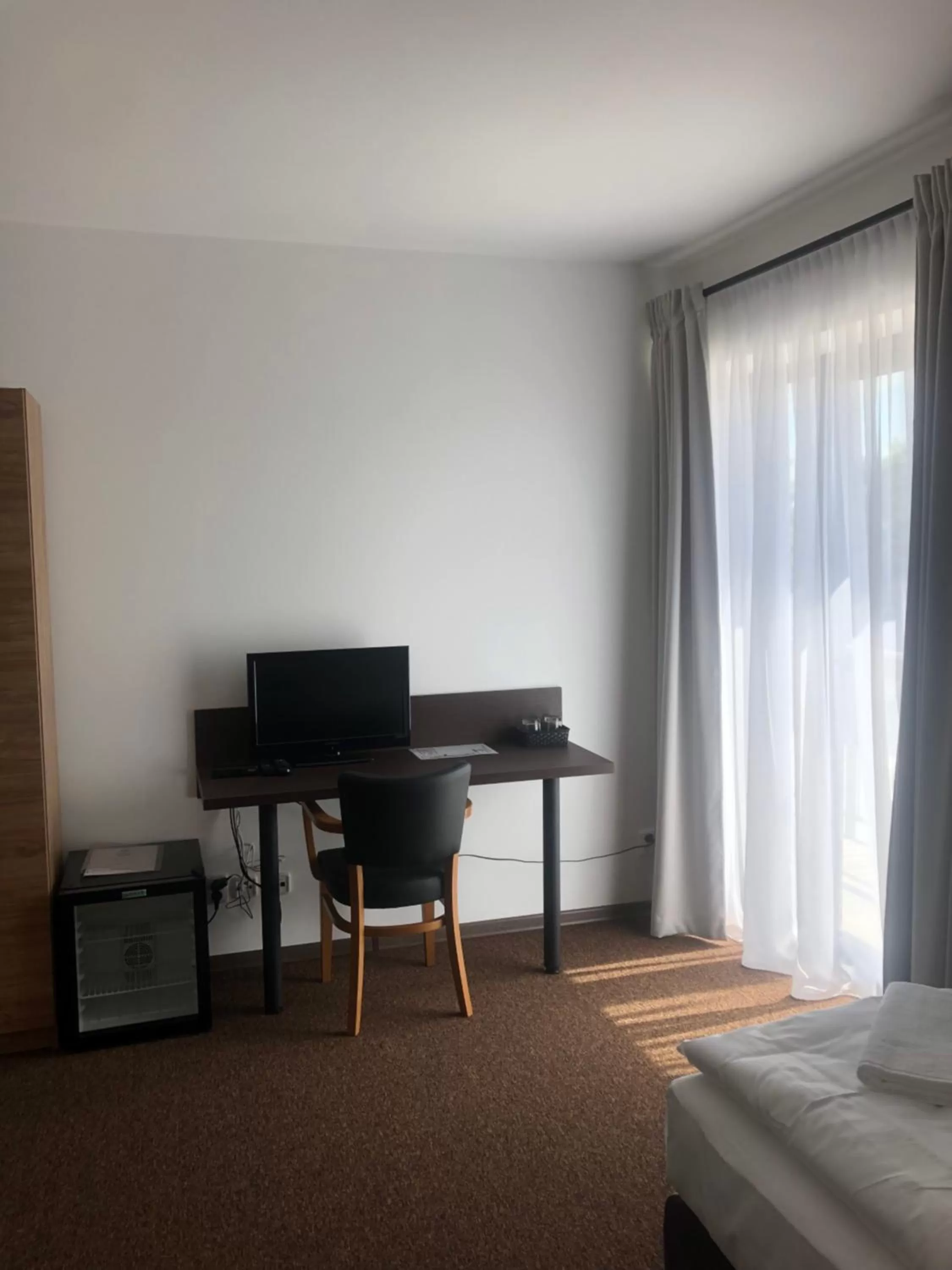 Communal lounge/ TV room, TV/Entertainment Center in Hotel Sport Mlada Boleslav