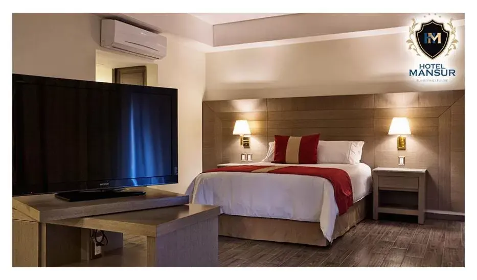 Bed in Hotel Mansur Business & Leisure