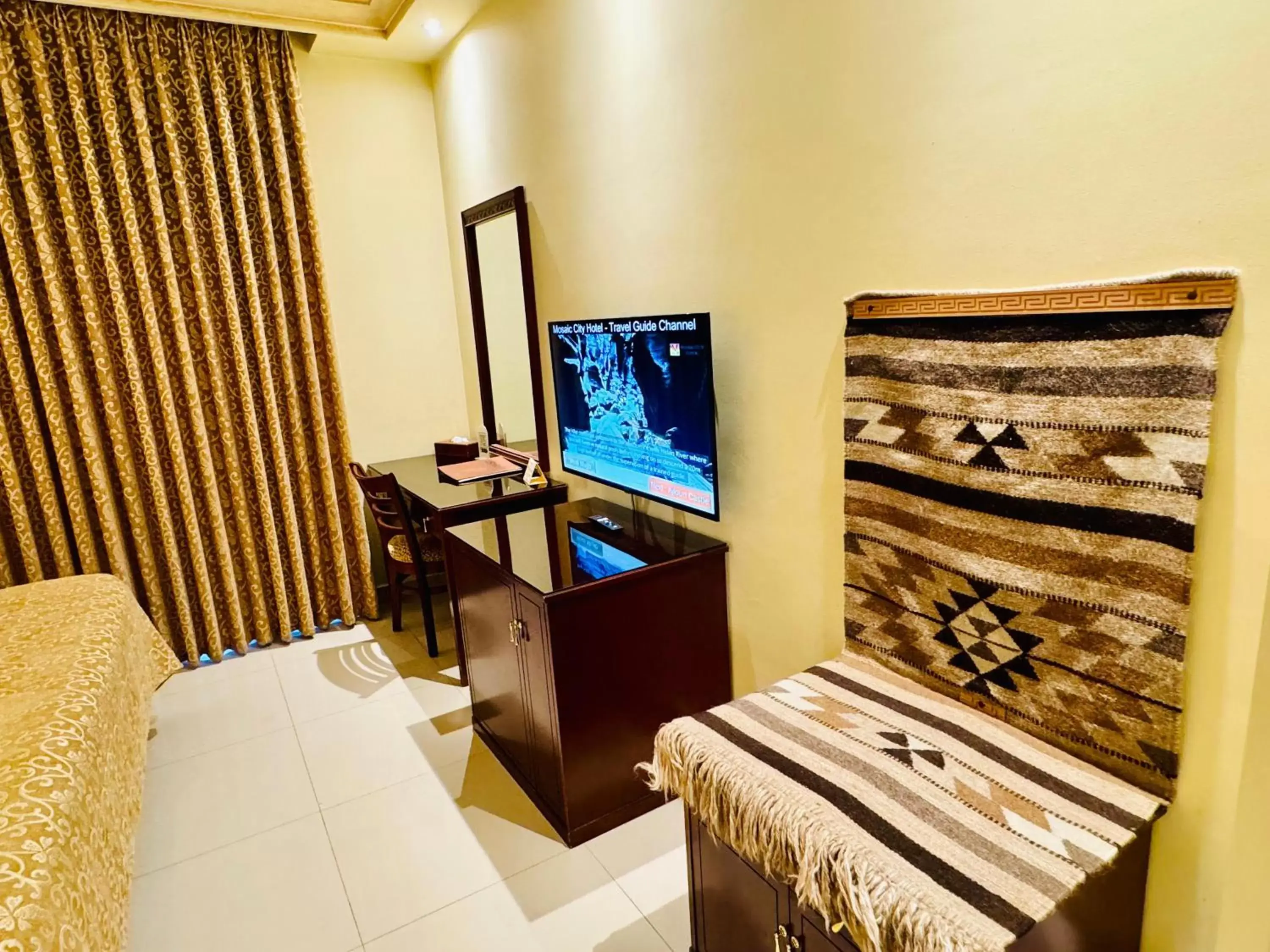 TV and multimedia, TV/Entertainment Center in Mosaic City Hotel