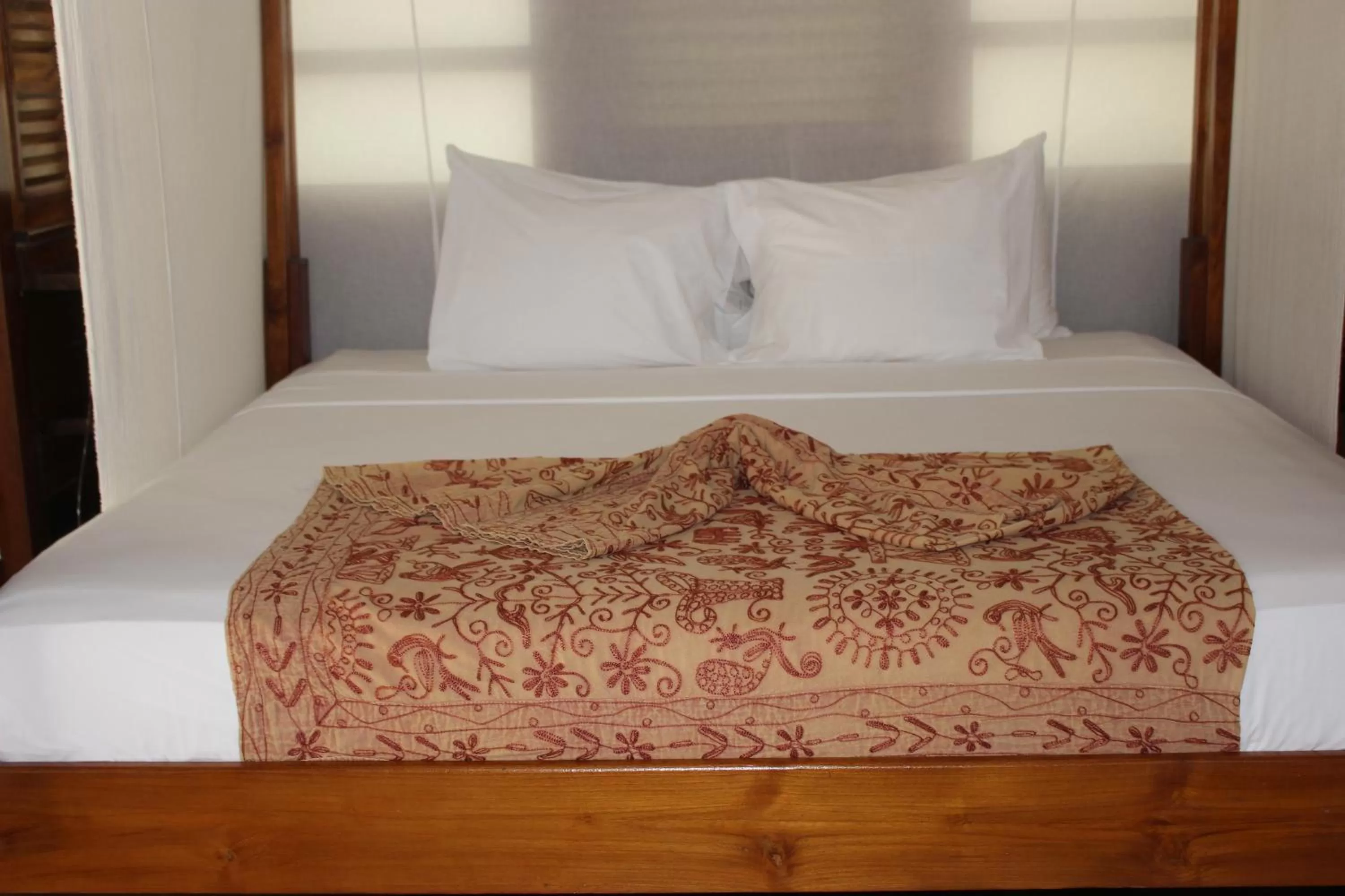 Bed in Acajou Hotel