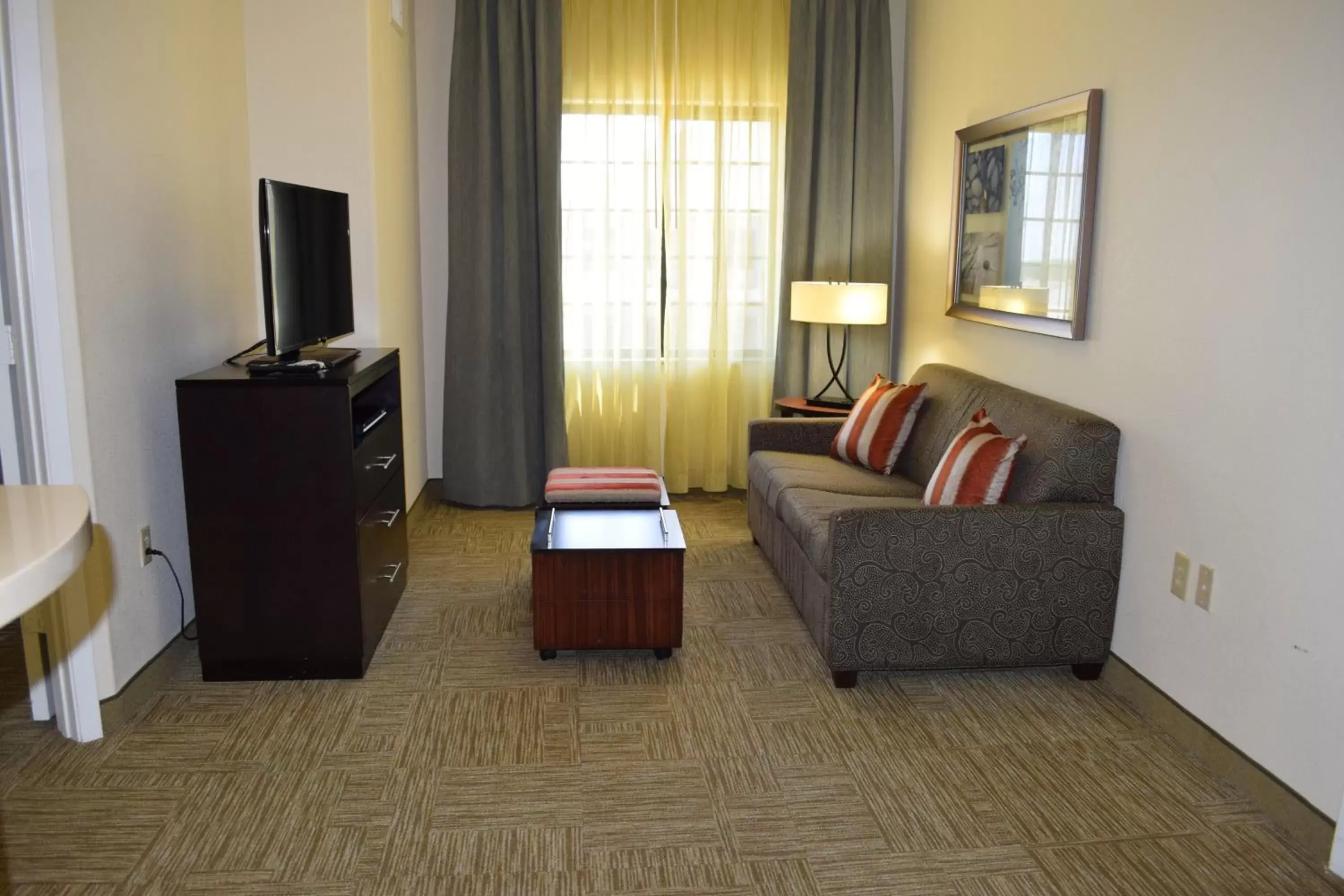 Photo of the whole room, Seating Area in Staybridge Suites Houston Stafford - Sugar Land, an IHG Hotel