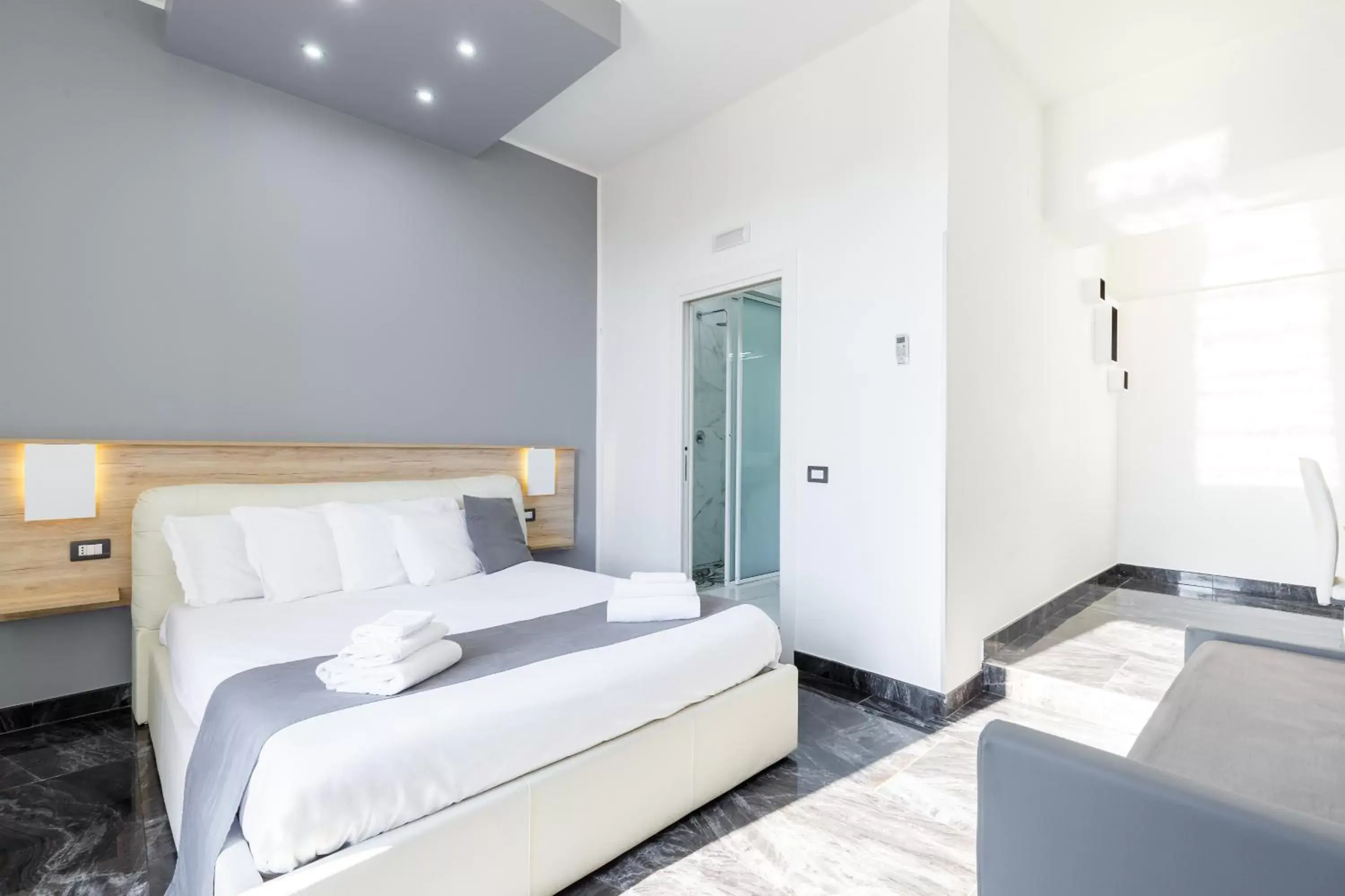 Bed in Bella Napoli Suites
