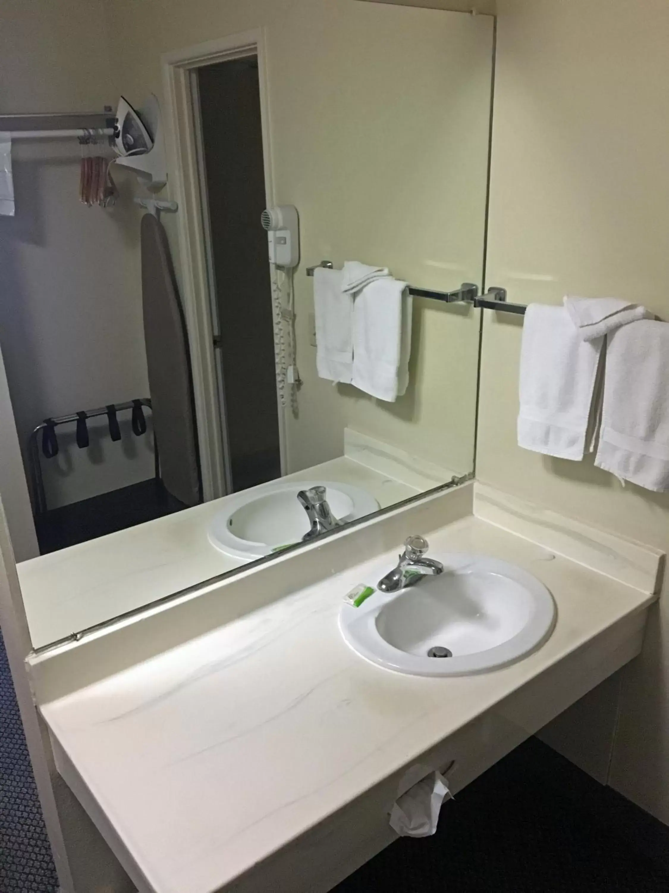 Bathroom in FairBridge Extended Stay, a Kitchenette Hotel