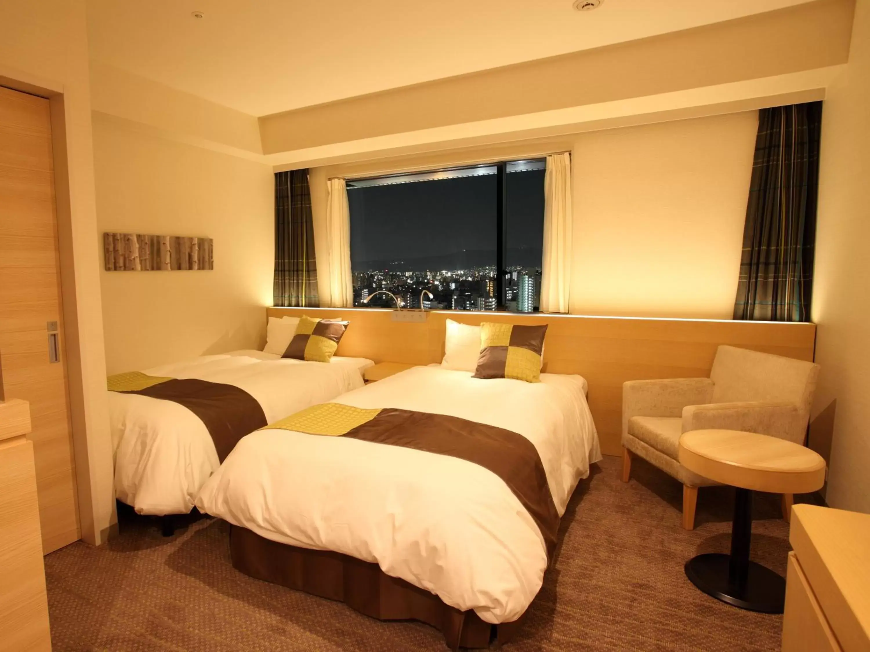 Bed in Hotel Keihan Kyobashi Grande