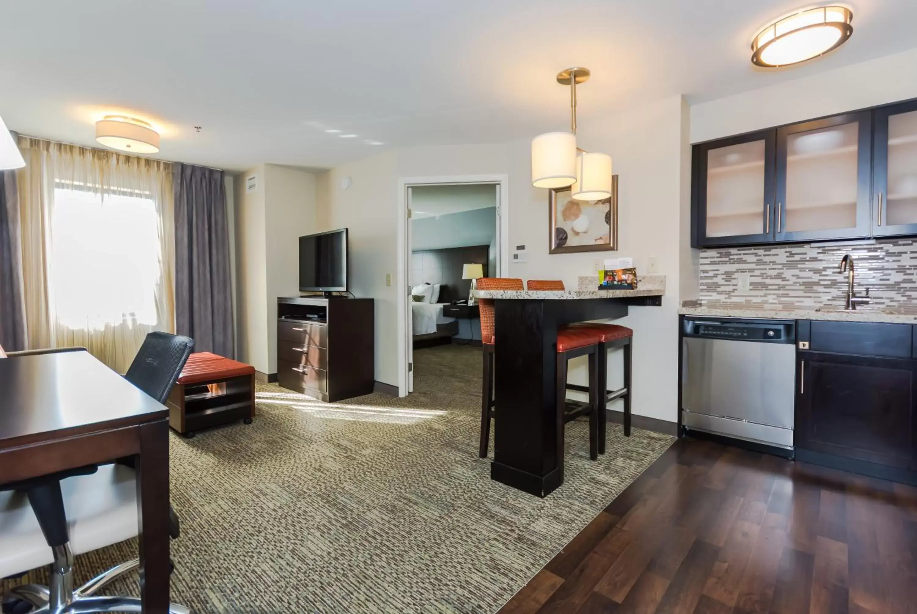 Photo of the whole room, Kitchen/Kitchenette in Staybridge Suites Grand Forks, an IHG Hotel