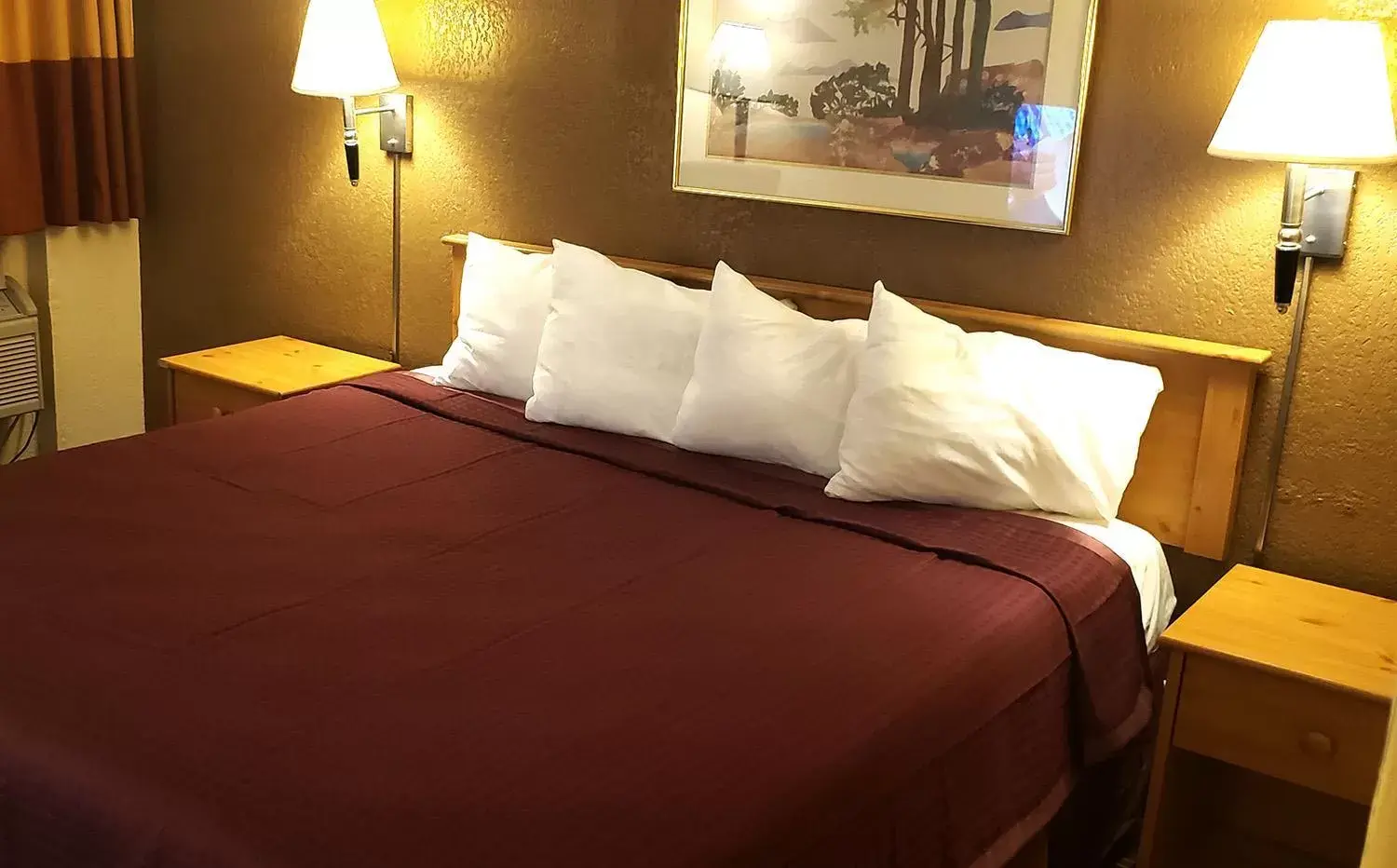 Bed in Coratel Inn & Suites by Jasper Mankato