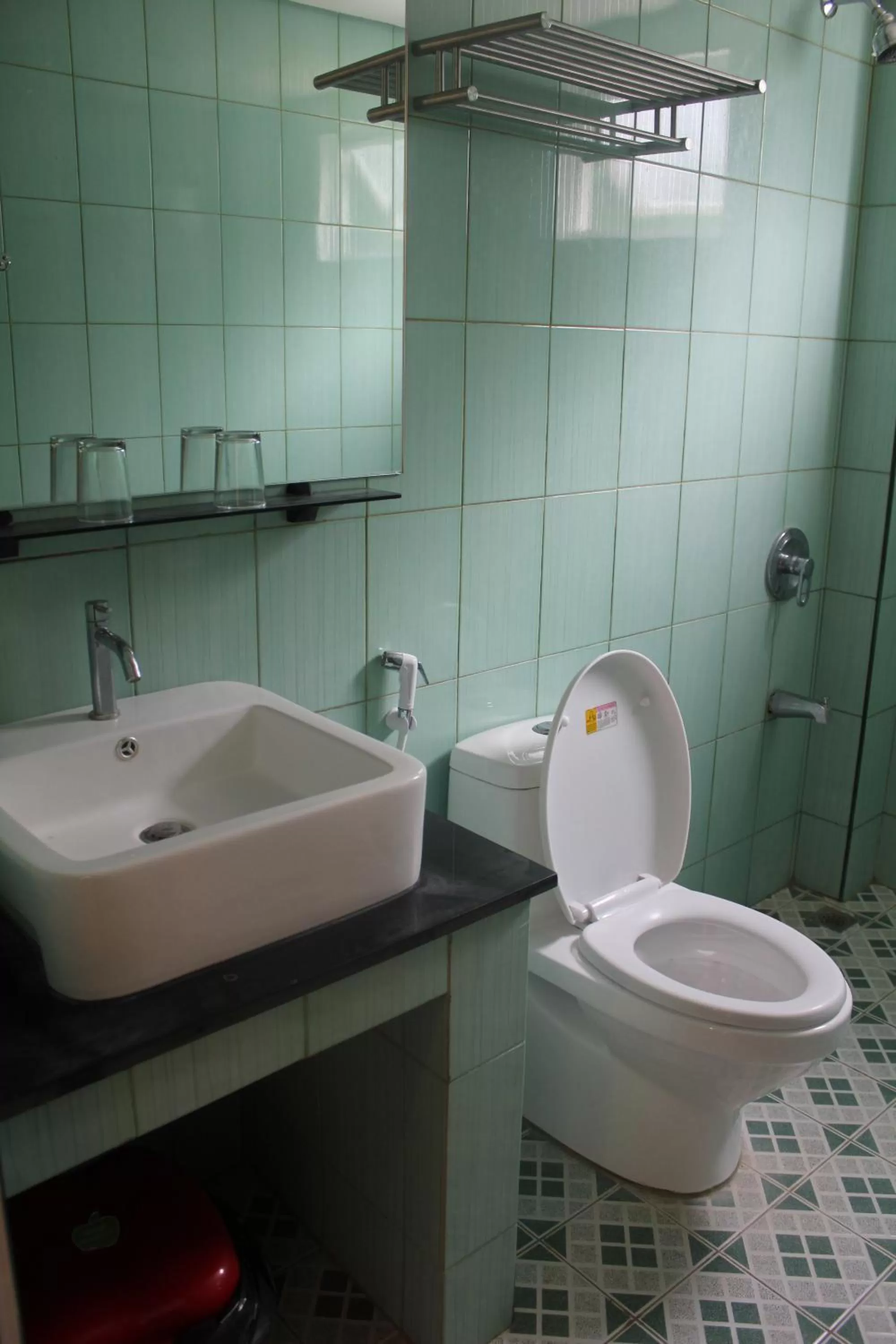 Toilet in Aqua Travel Lodge