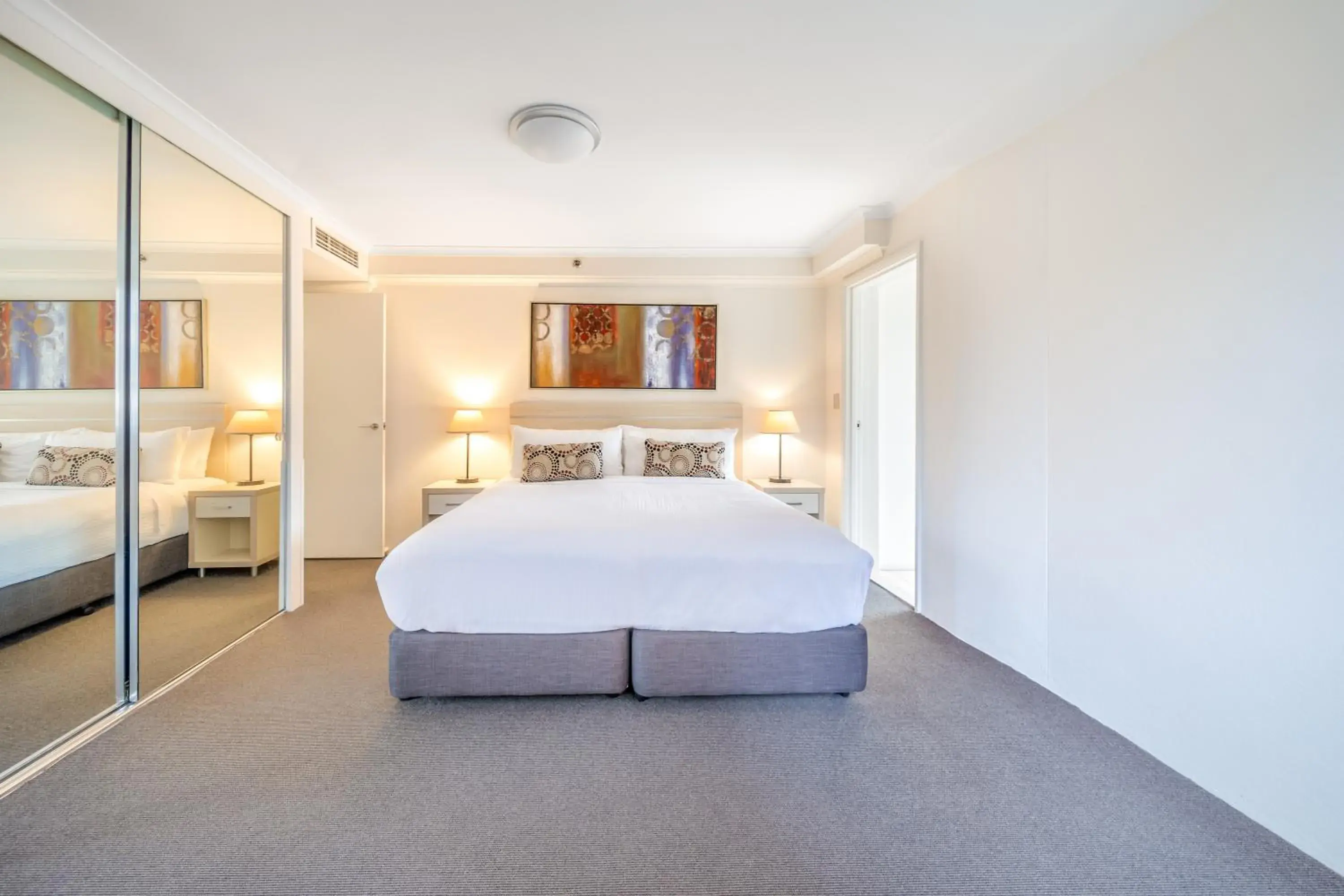 Bed in Oaks Sydney Castlereagh Suites