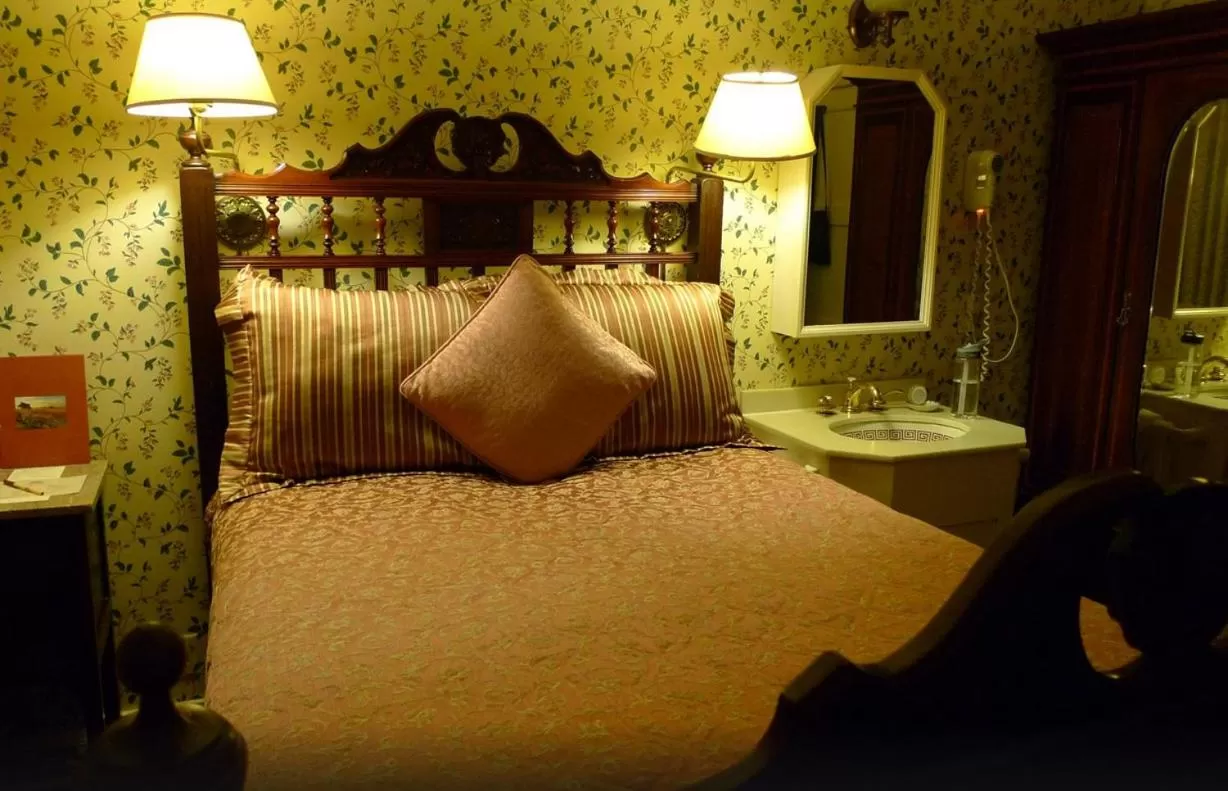 Photo of the whole room, Bed in Mendocino Hotel & Garden