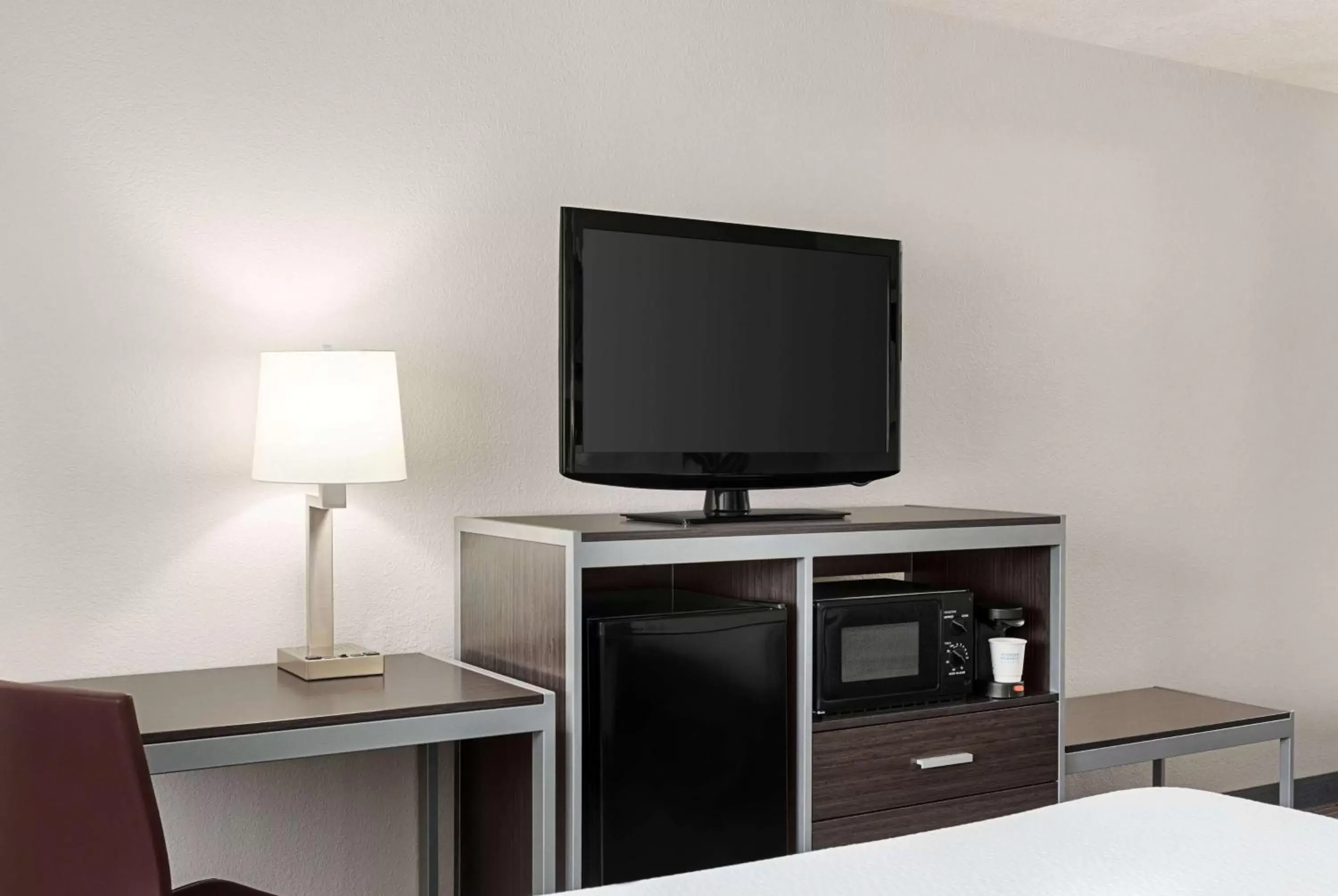 Photo of the whole room, TV/Entertainment Center in Days Inn by Wyndham San Antonio Near Fiesta Park