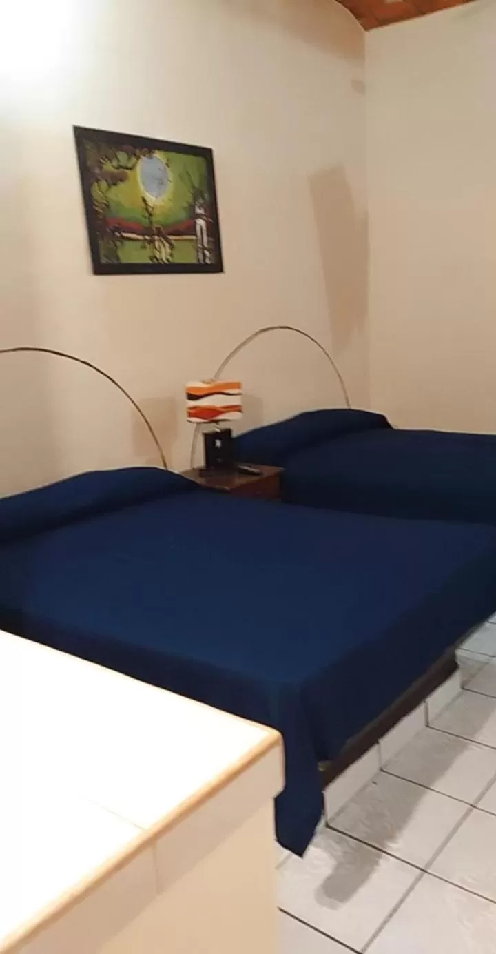 Bed in Bungalows Casa Regina